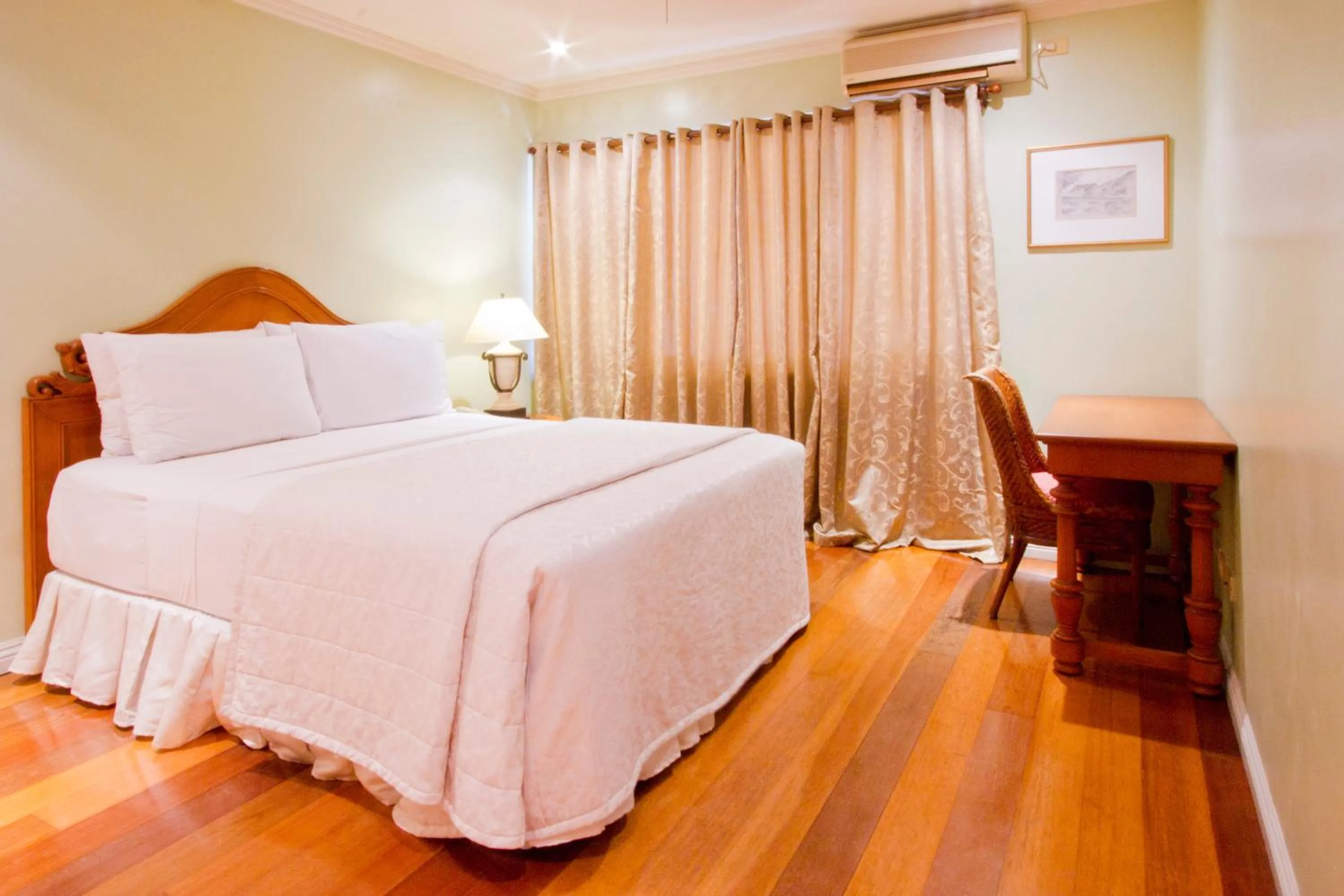 Bed in Sophia Suites Residence Hotel