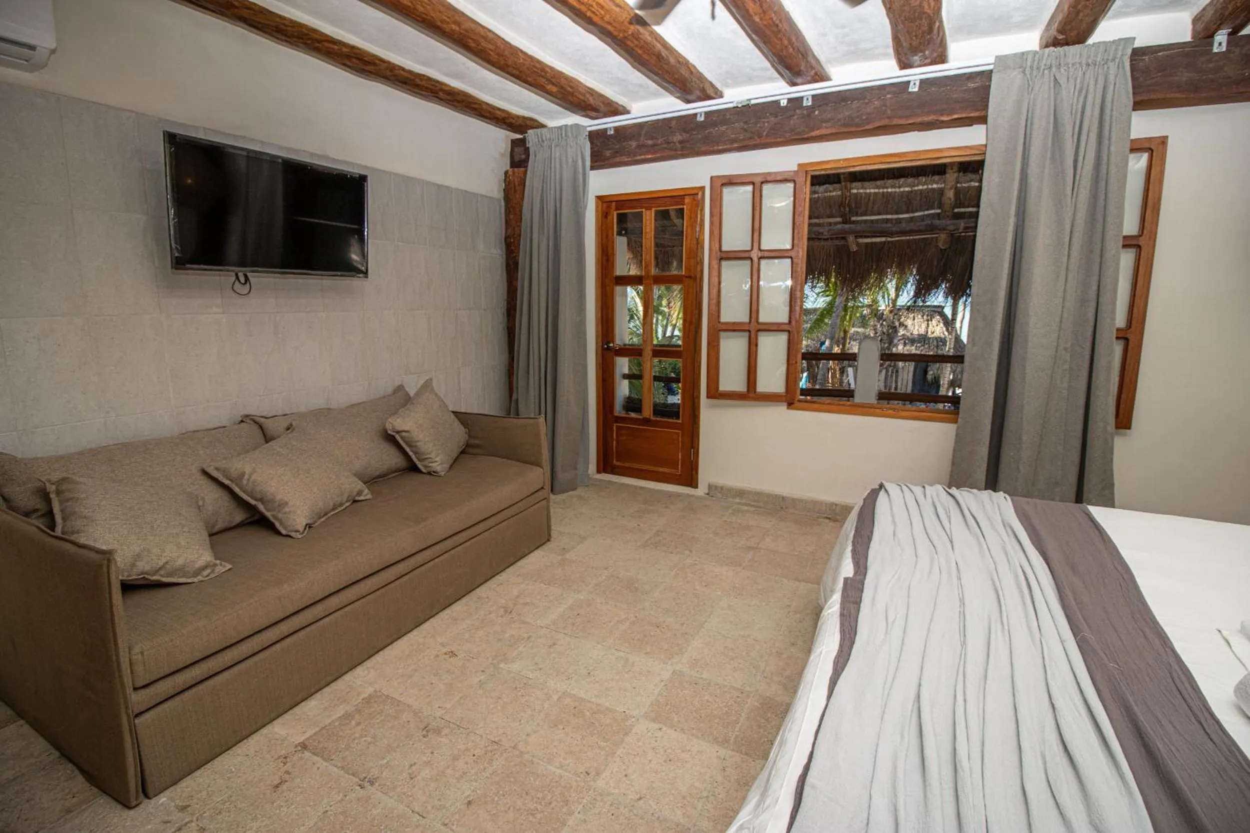 Photo of the whole room, Bed in Amaite Holbox - Oceanfront Hotel