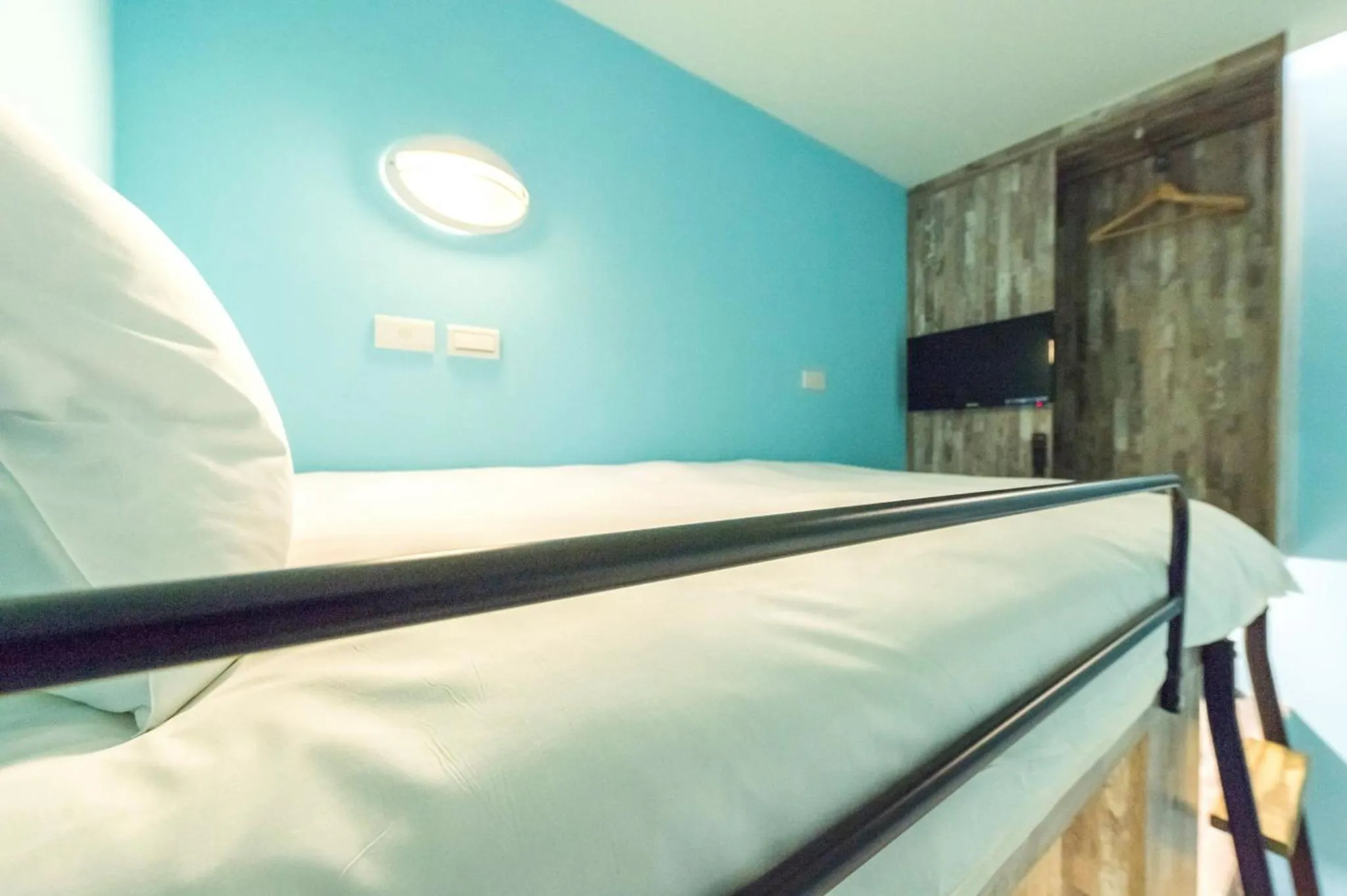 Bed in Divecube Hotel