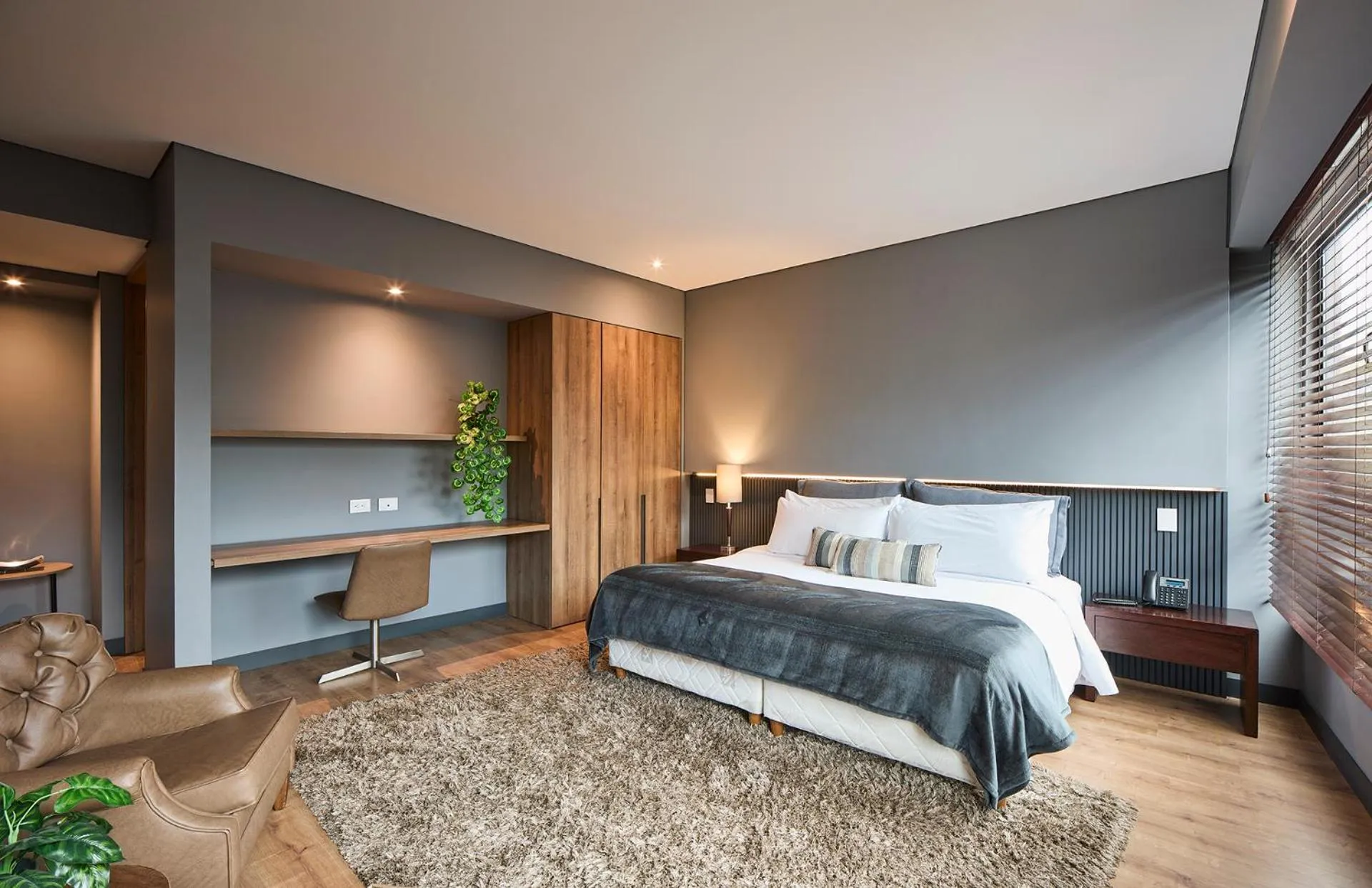 Bed in Nico Apartasuites