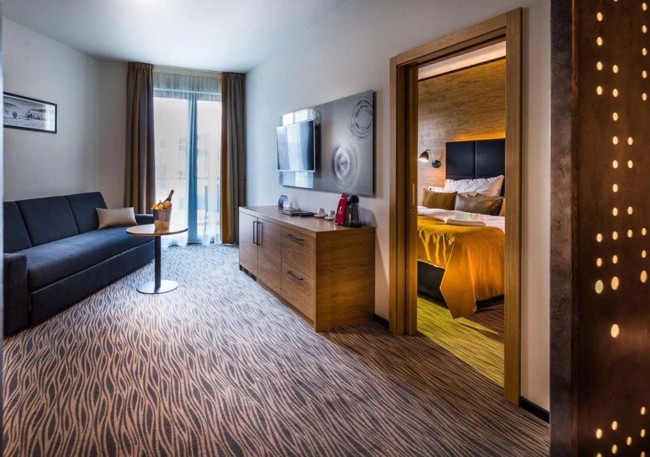 Living room, Bed in Hotel Galeria Thermal Bešeňová