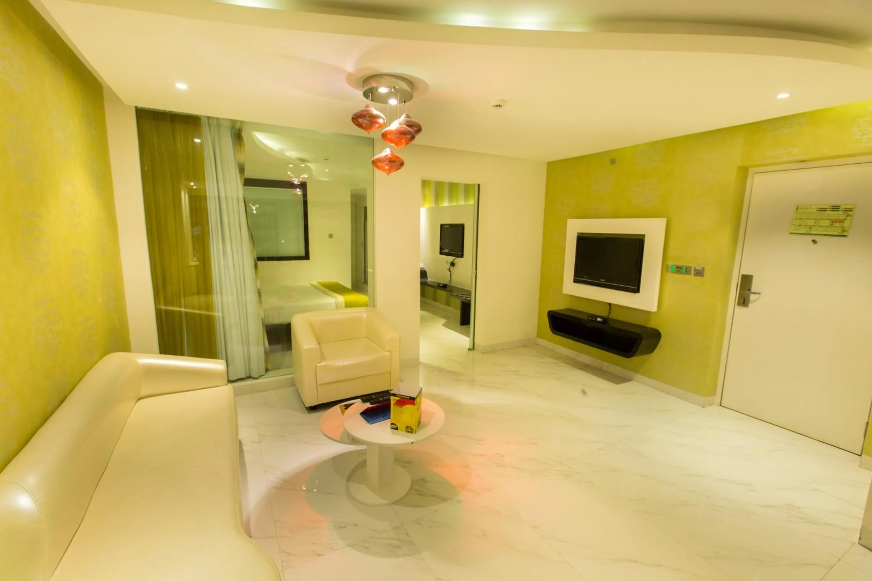 Communal lounge/ TV room in Hash Six Hotels