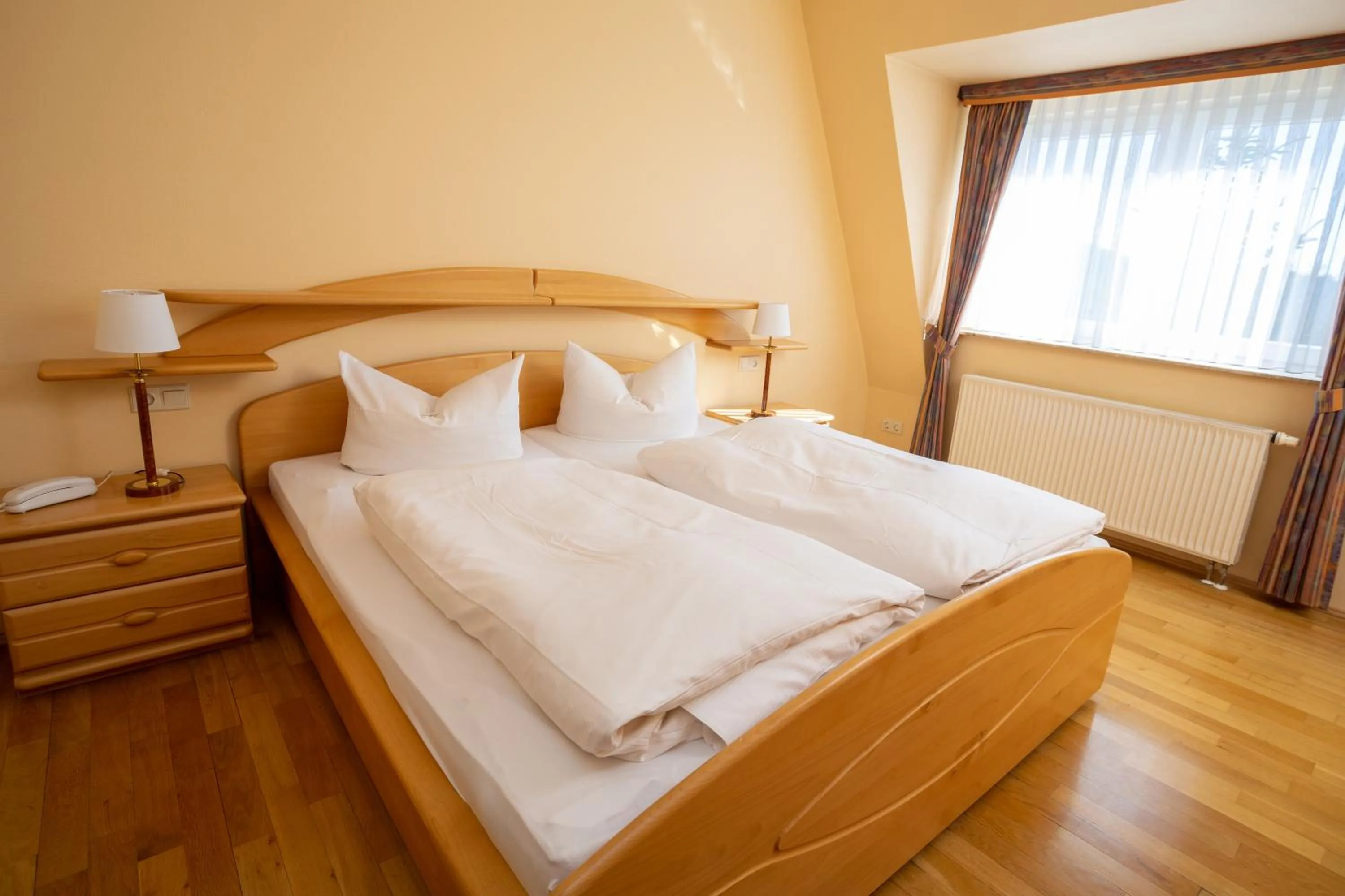 Photo of the whole room, Bed in Aktivhotel Heikenberg in Bad Lauterberg