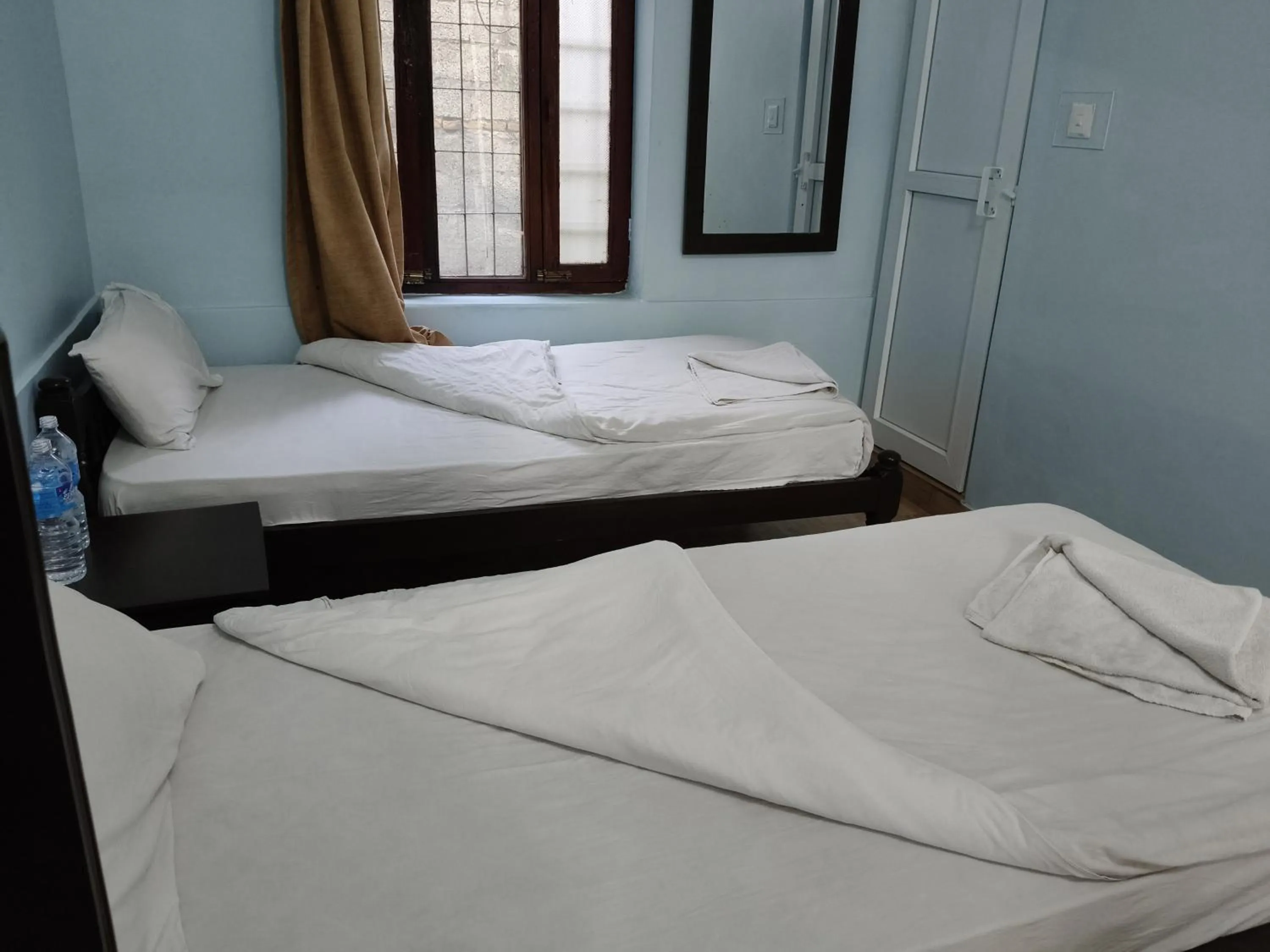 Bed in Yeti Guest House