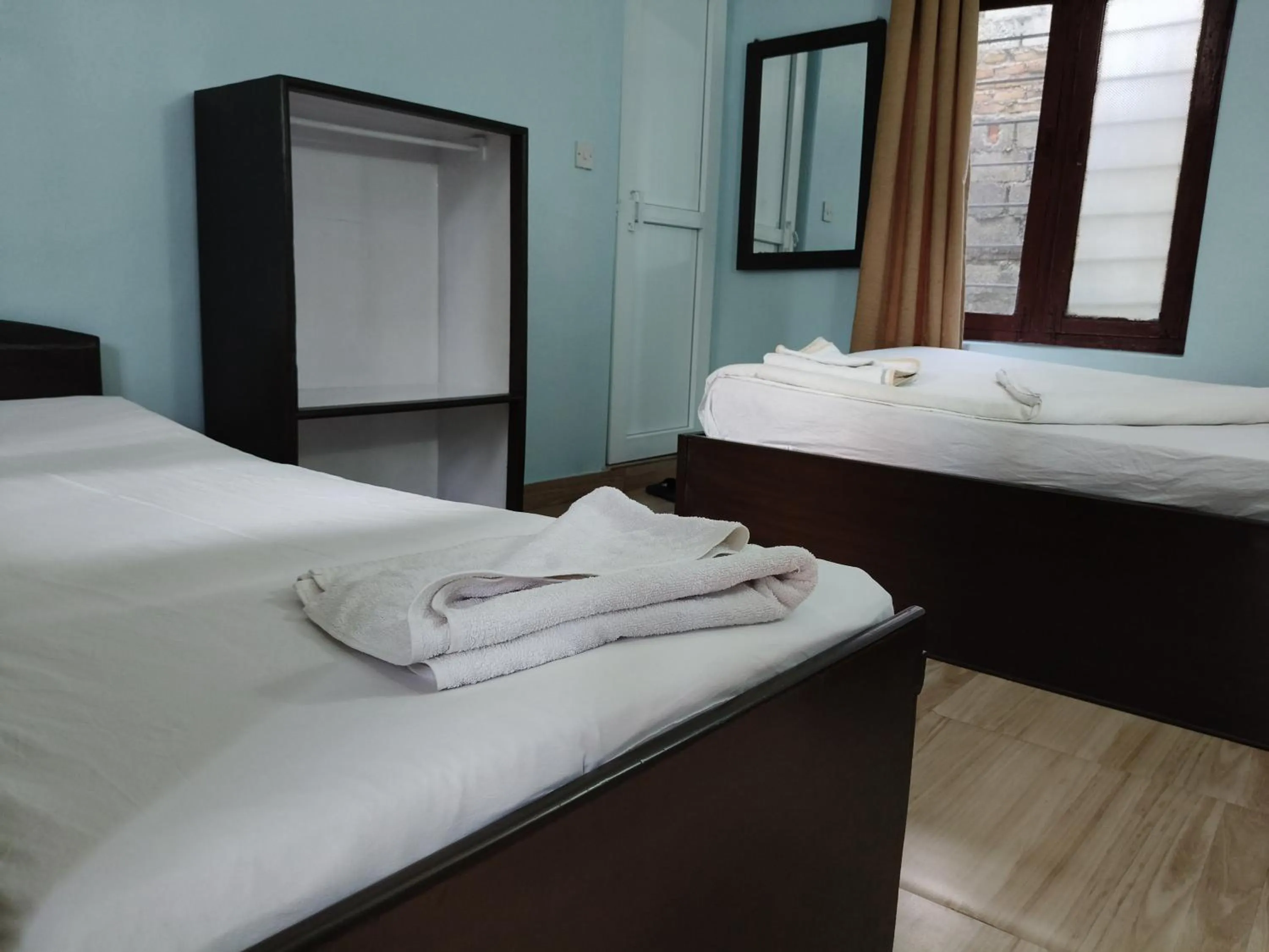 Bed in Yeti Guest House