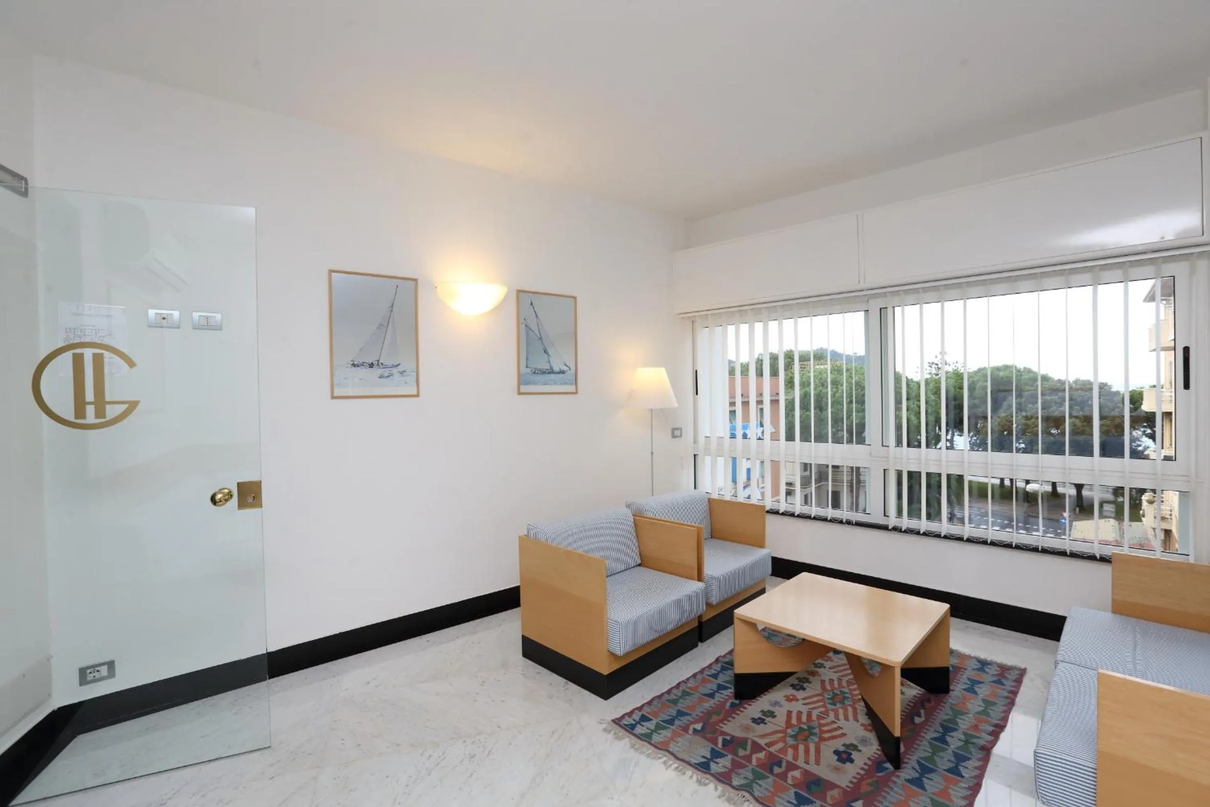 Communal lounge/ TV room in Hotel Genova