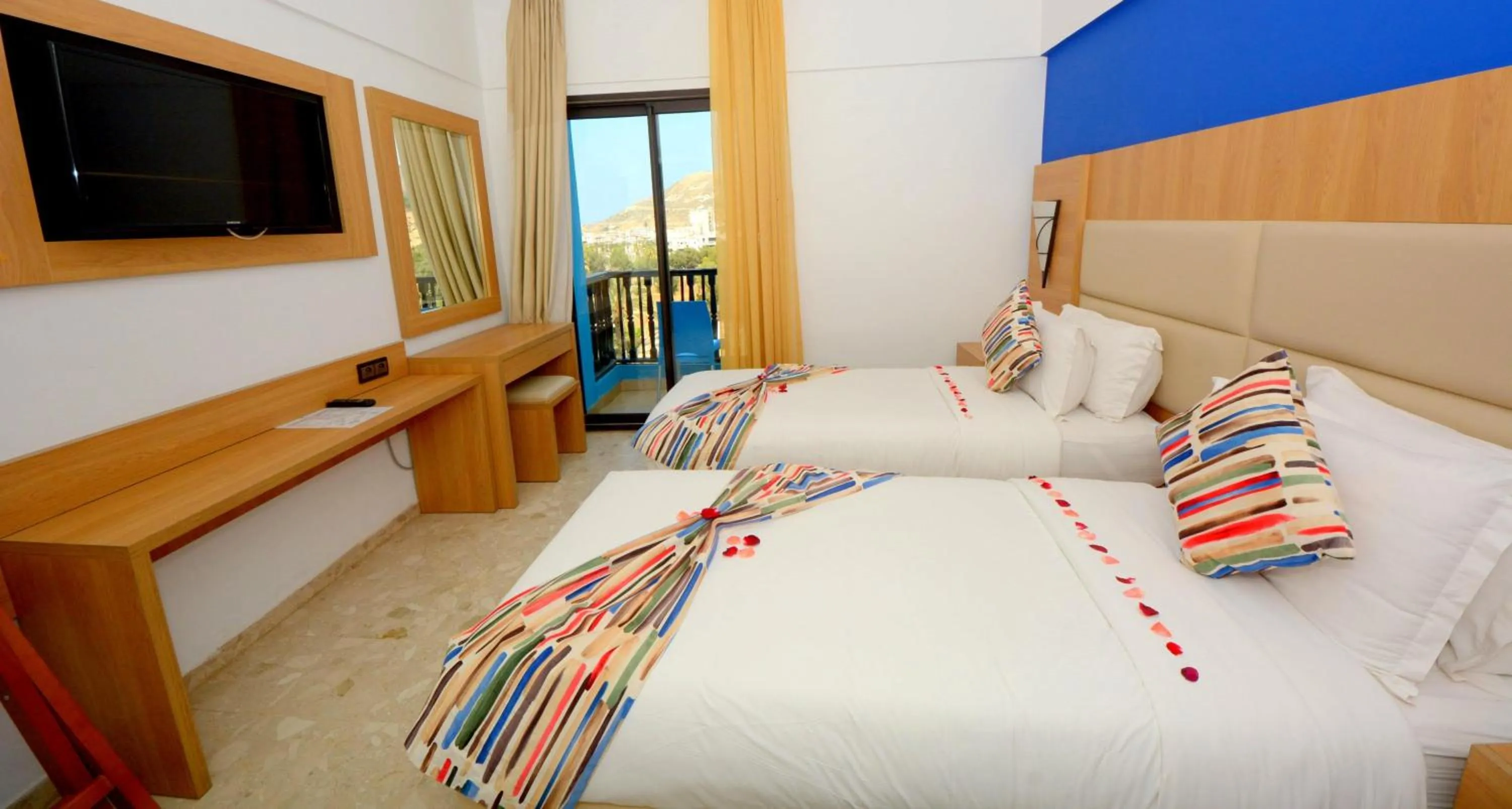 Bed in Oasis Hotel & Spa