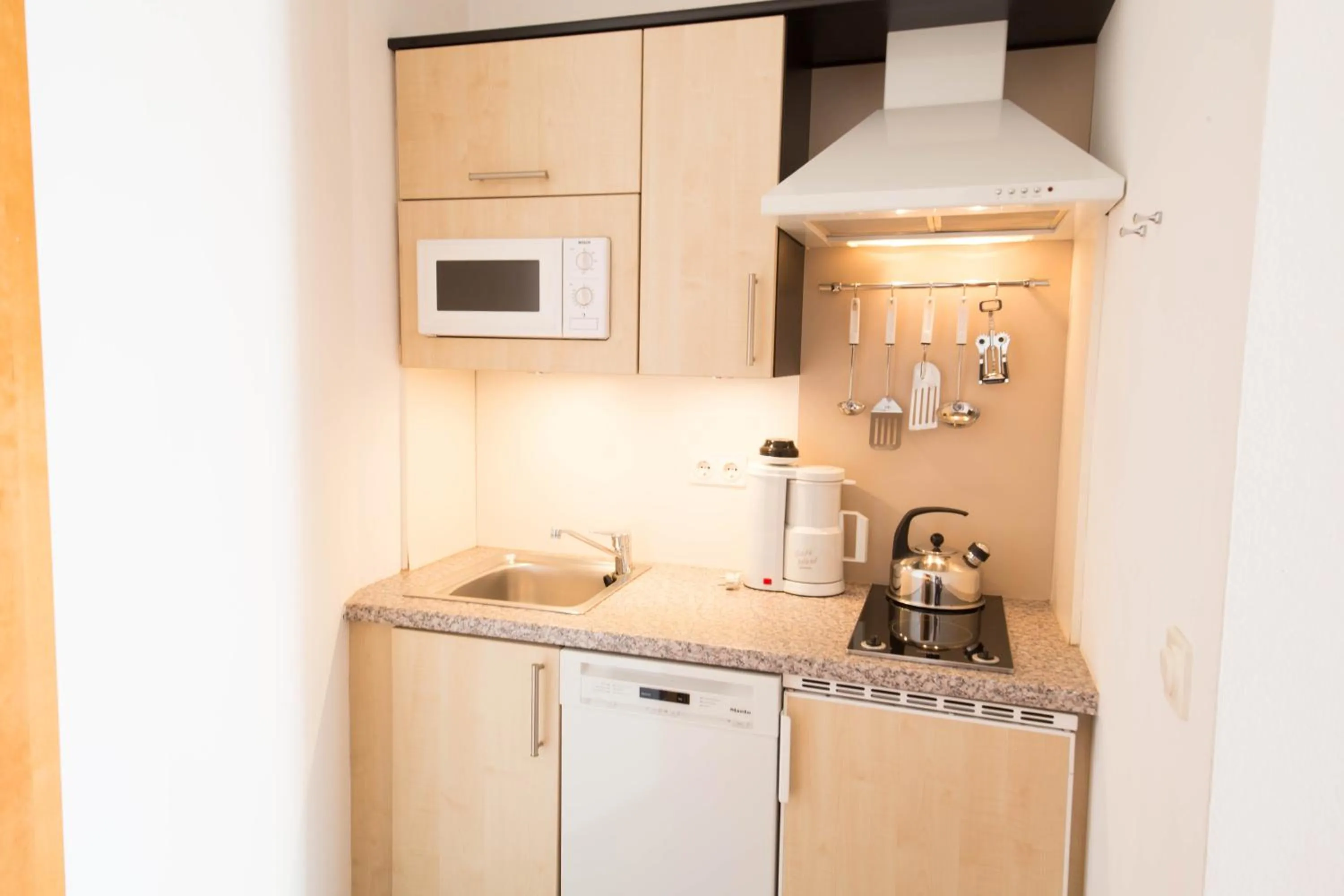 Kitchen or kitchenette in Werzer Strandcasino Hotel