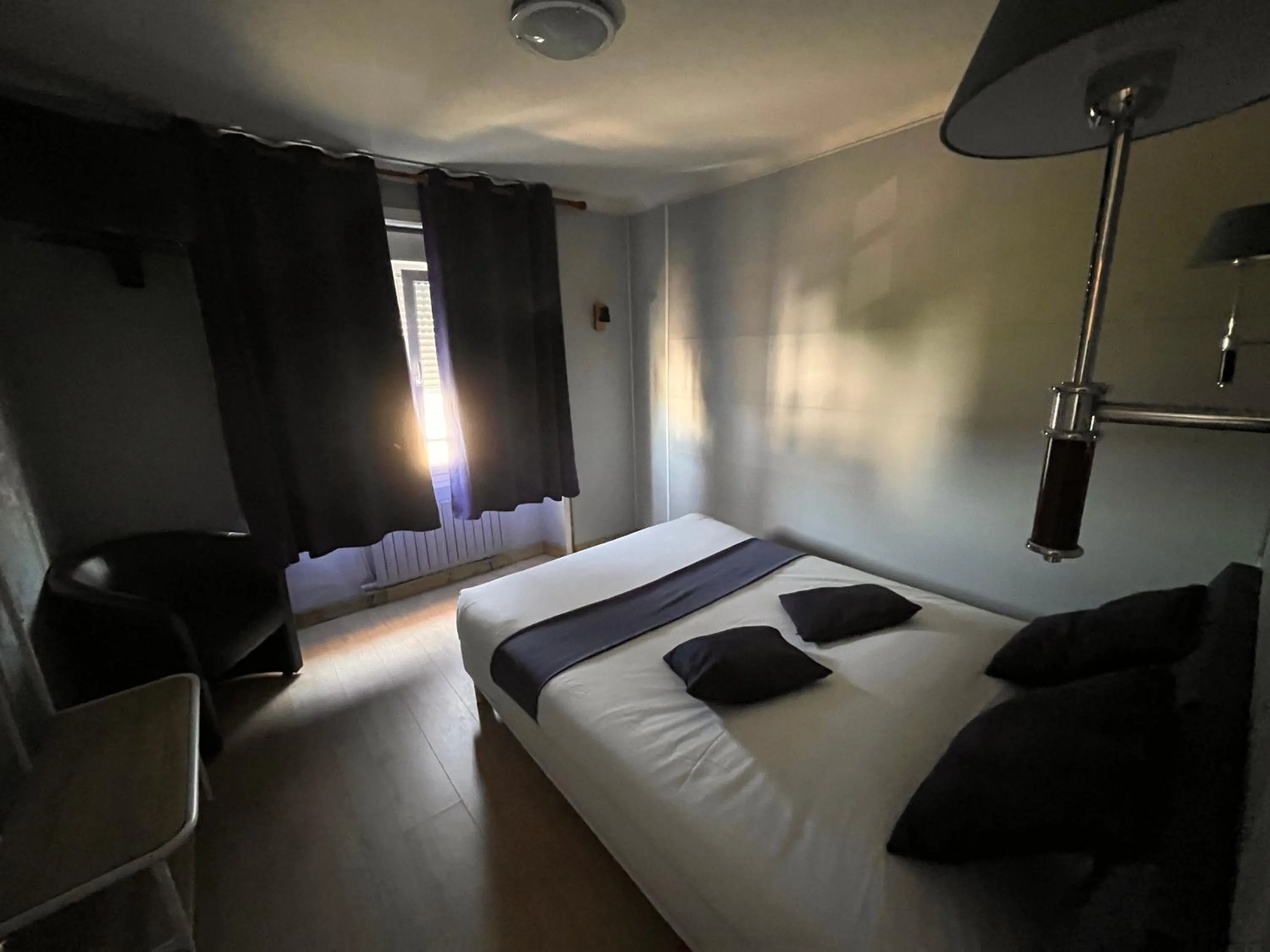 Bed in Hôtel des îles