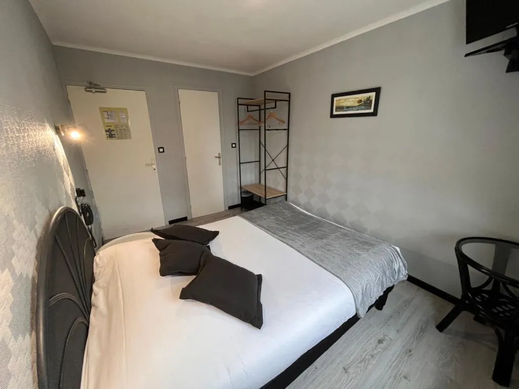 Bed in Hôtel des îles