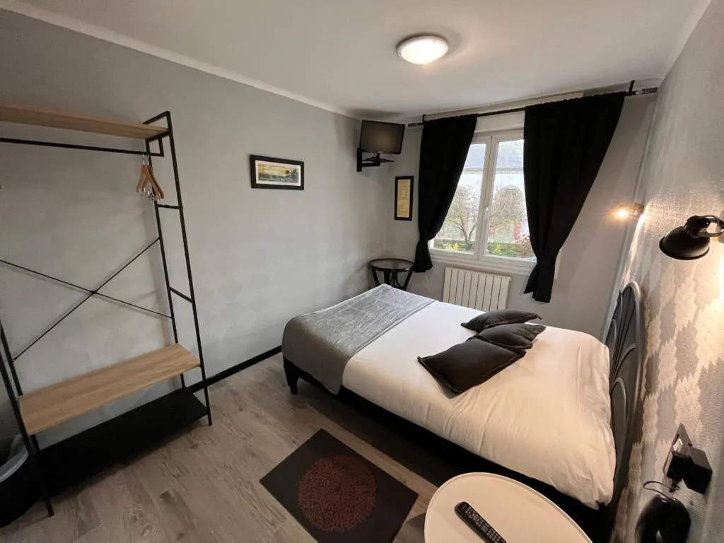 Bed in Hôtel des îles