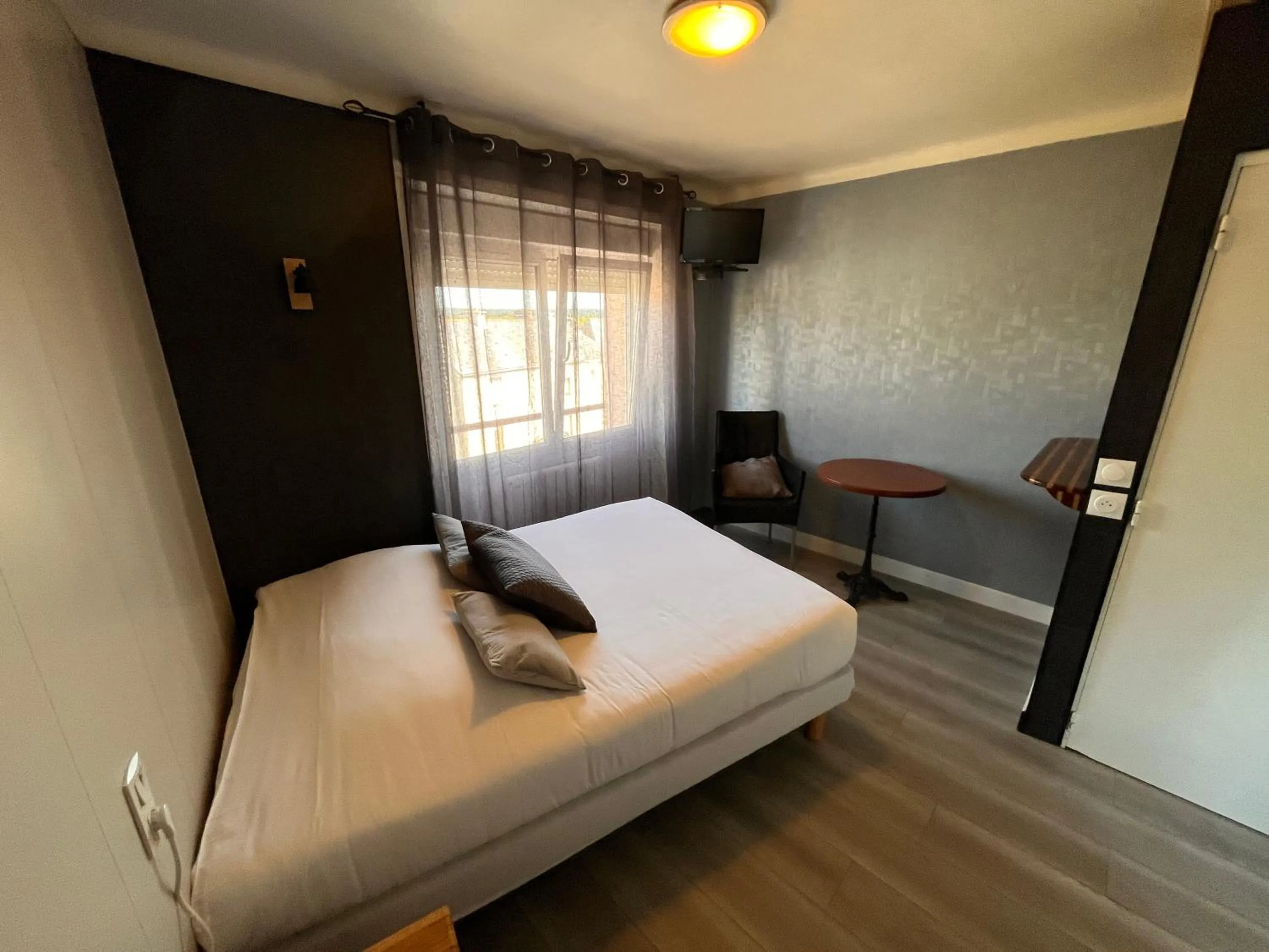 Bed in Hôtel des îles