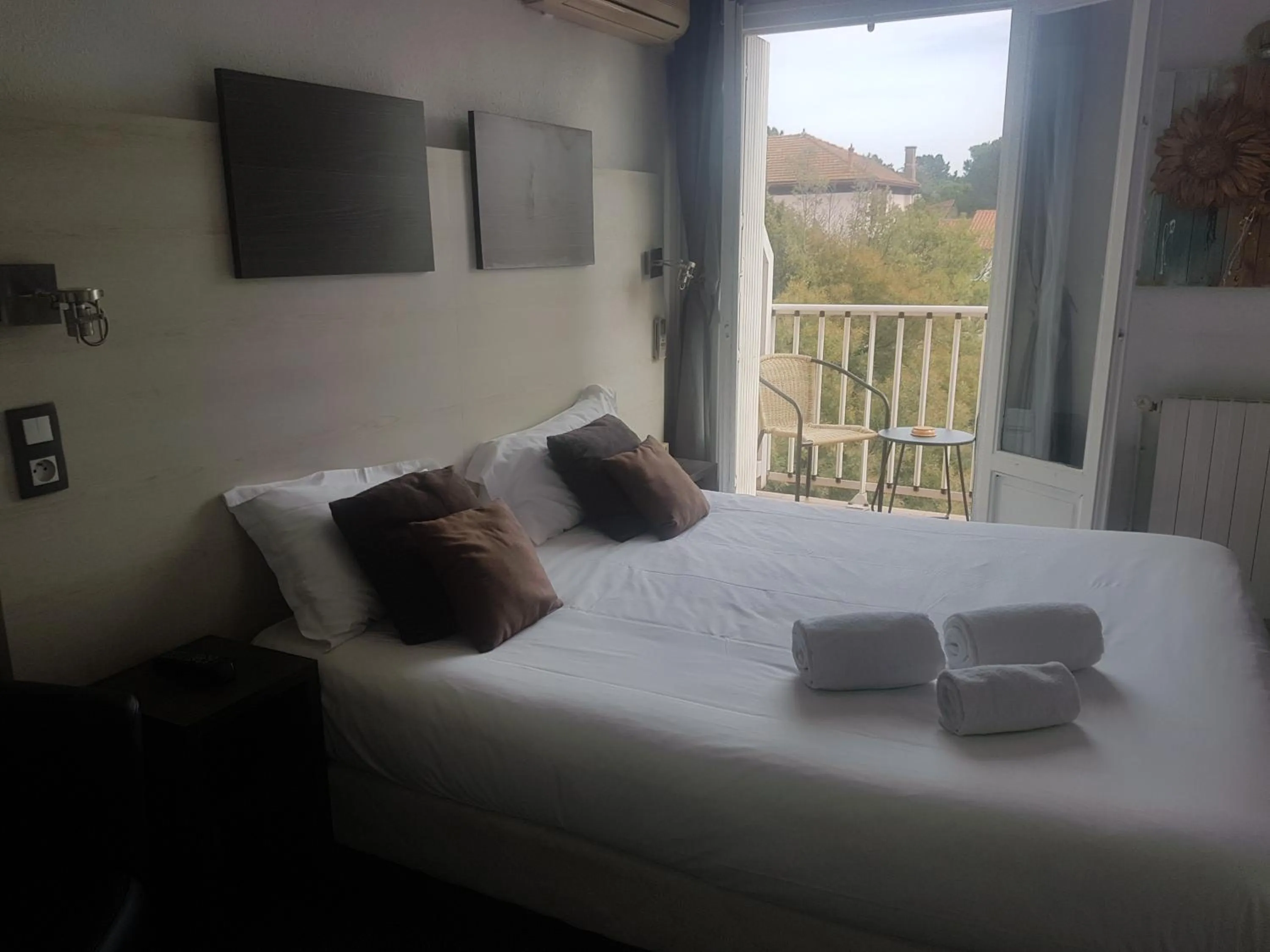 Photo of the whole room, Bed in Logis Hôtel Restaurant les Charmettes