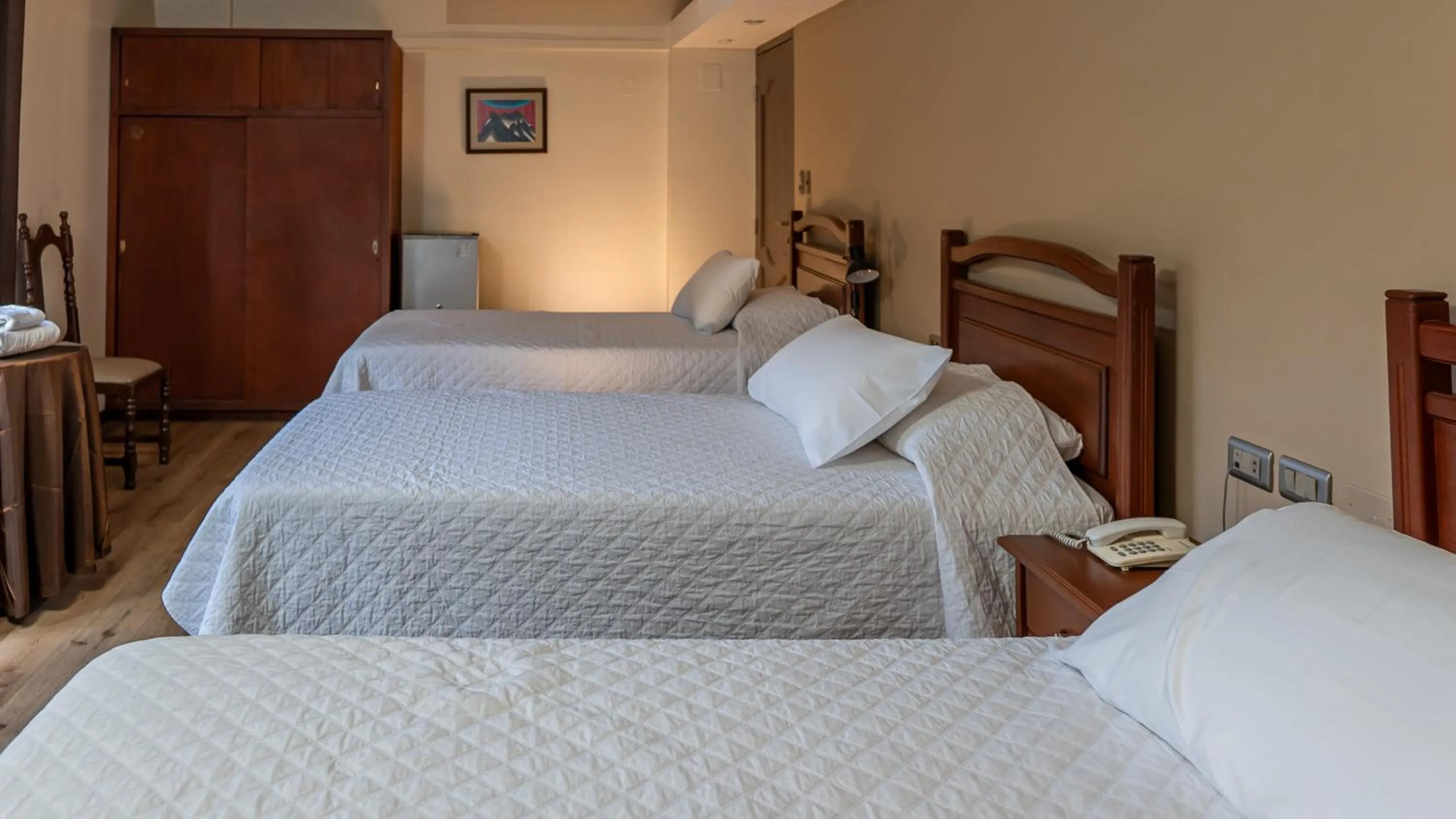 Bed in El Prado Hotel