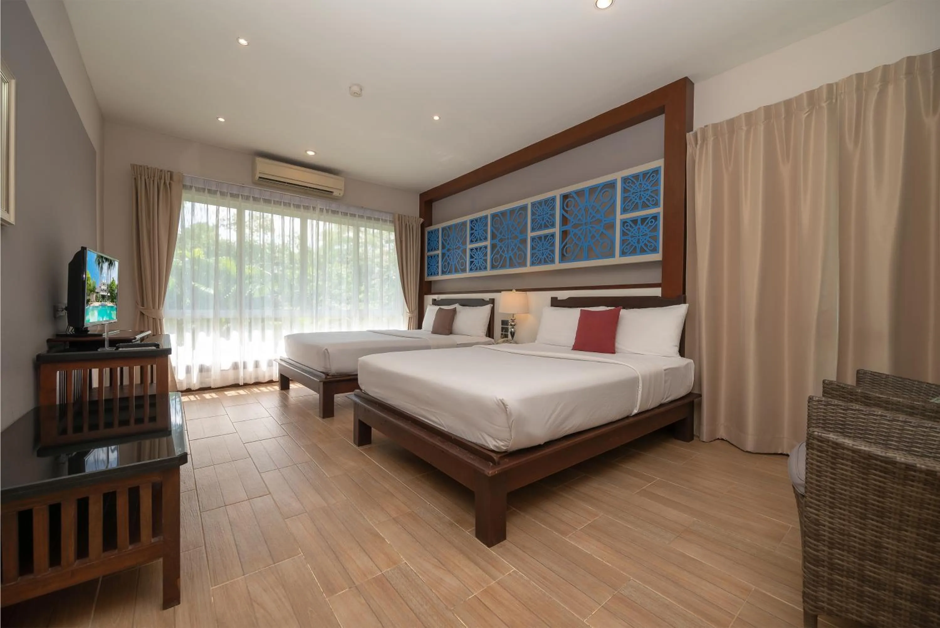 Bed in Le Charme Sukhothai Historical Park