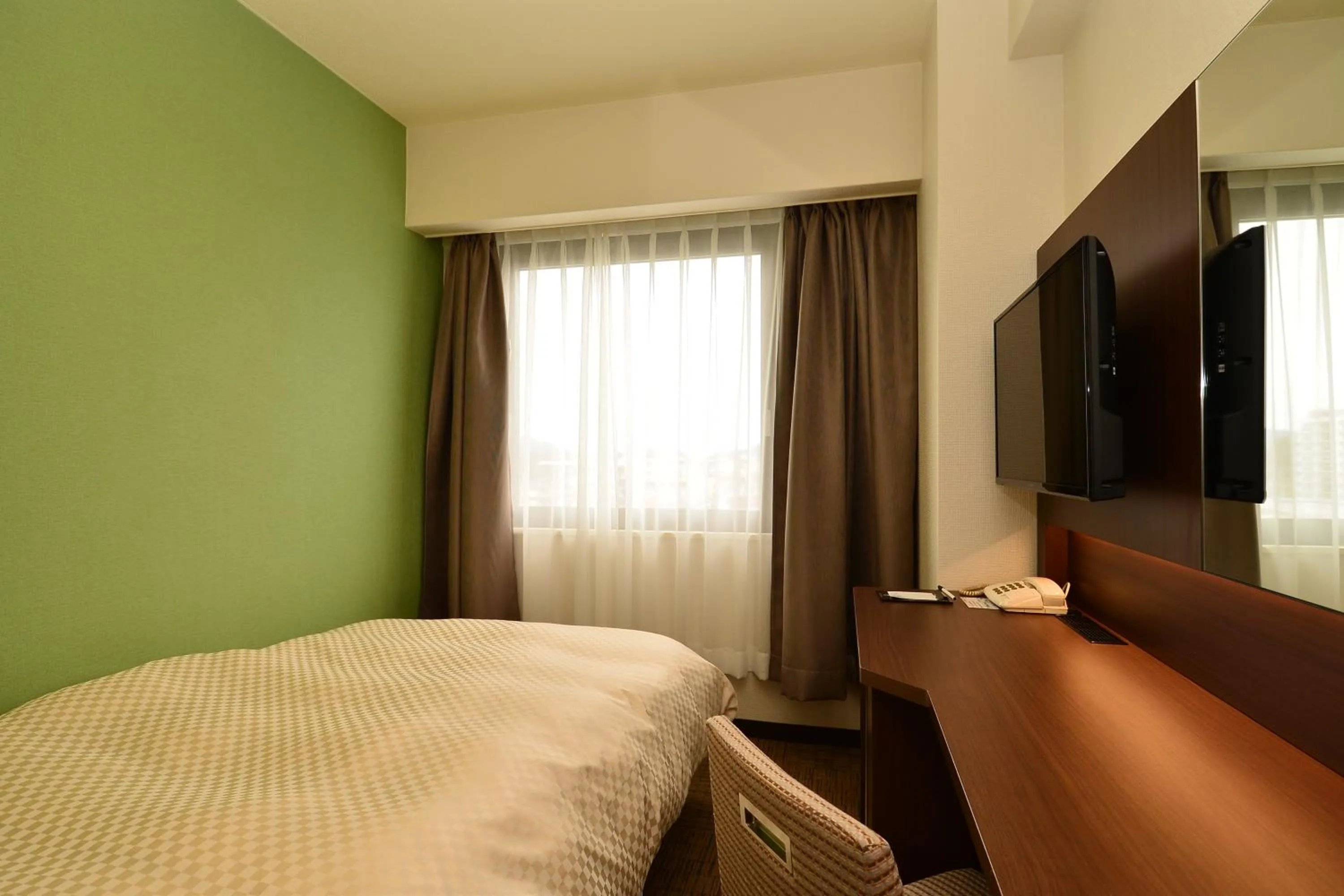 Bed in Hotel Sunroute Sano