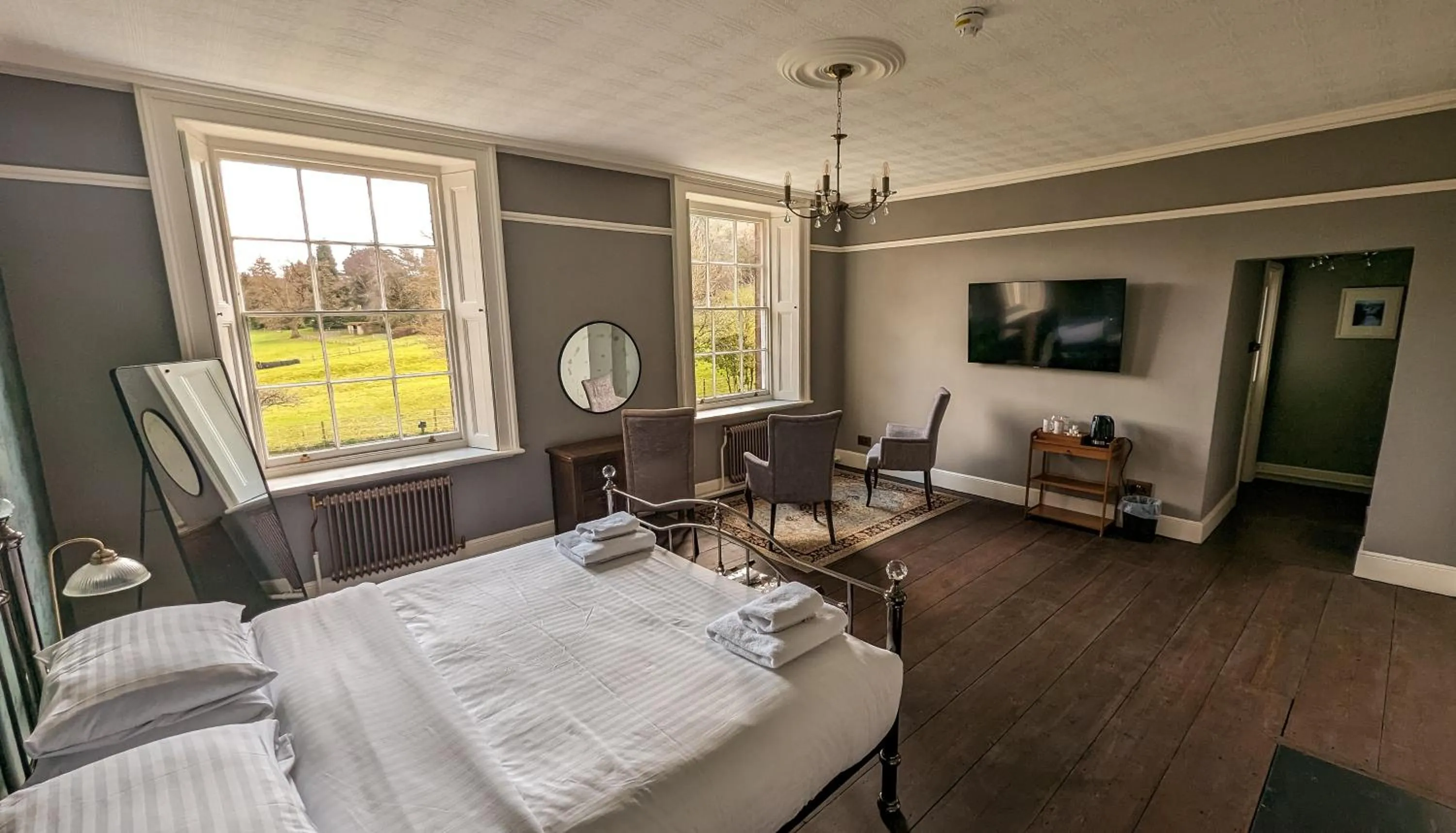 Seating area, Bed in Oakhill Hotel