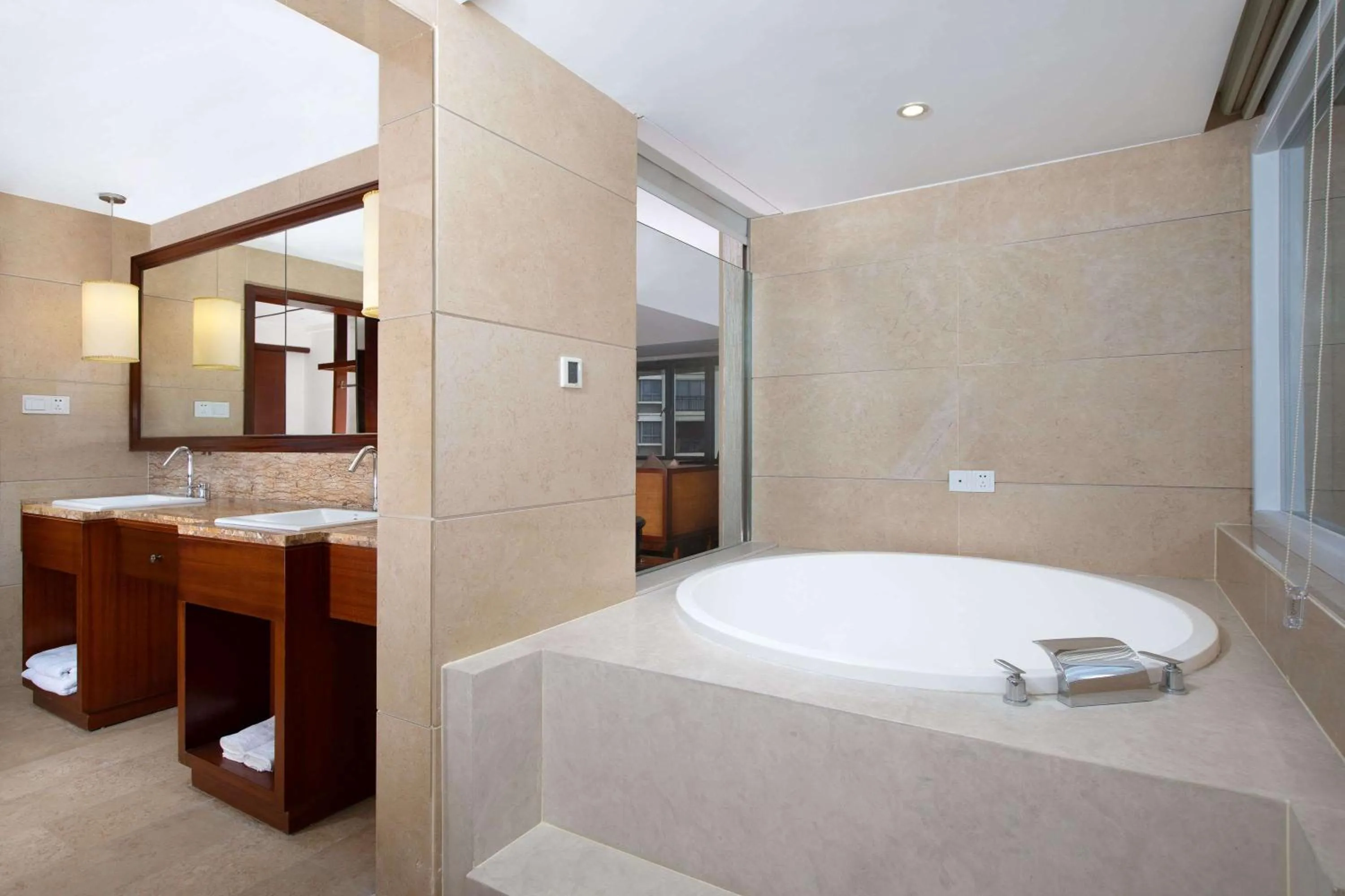 Bathroom in Ramada Encore by Wyndham Qionghai Downtown