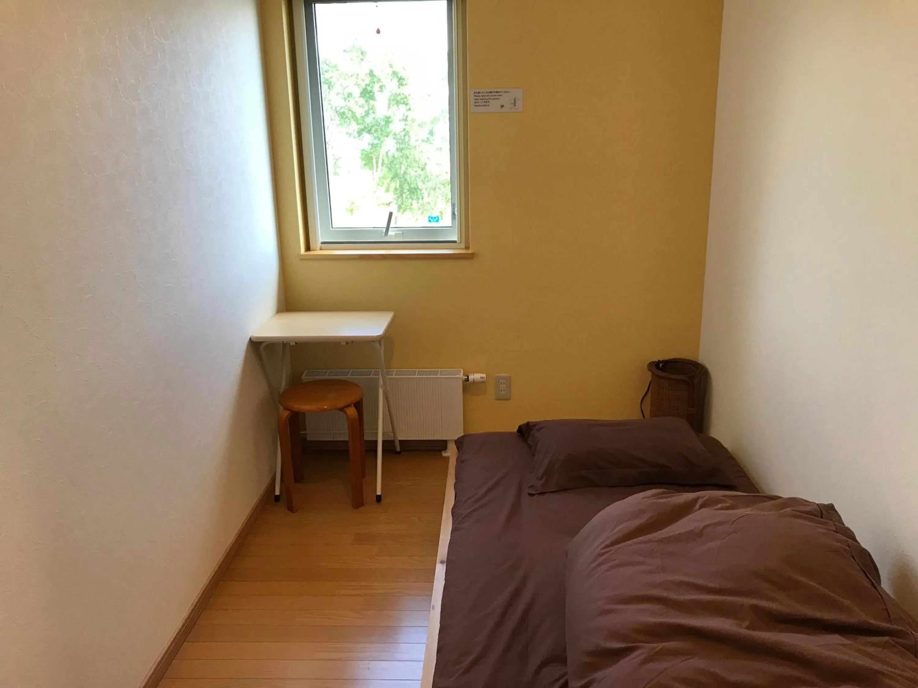 Bed in Niseko Guesthouse Nalu.