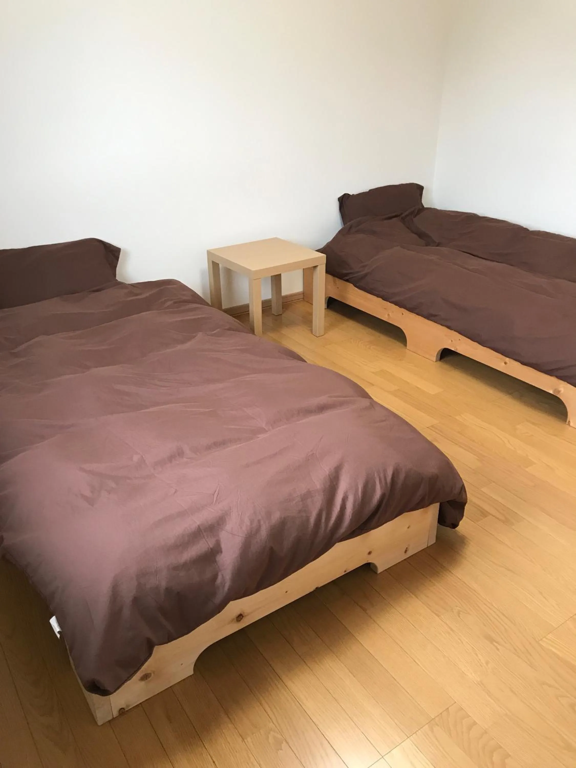 Bed in Niseko Guesthouse Nalu.