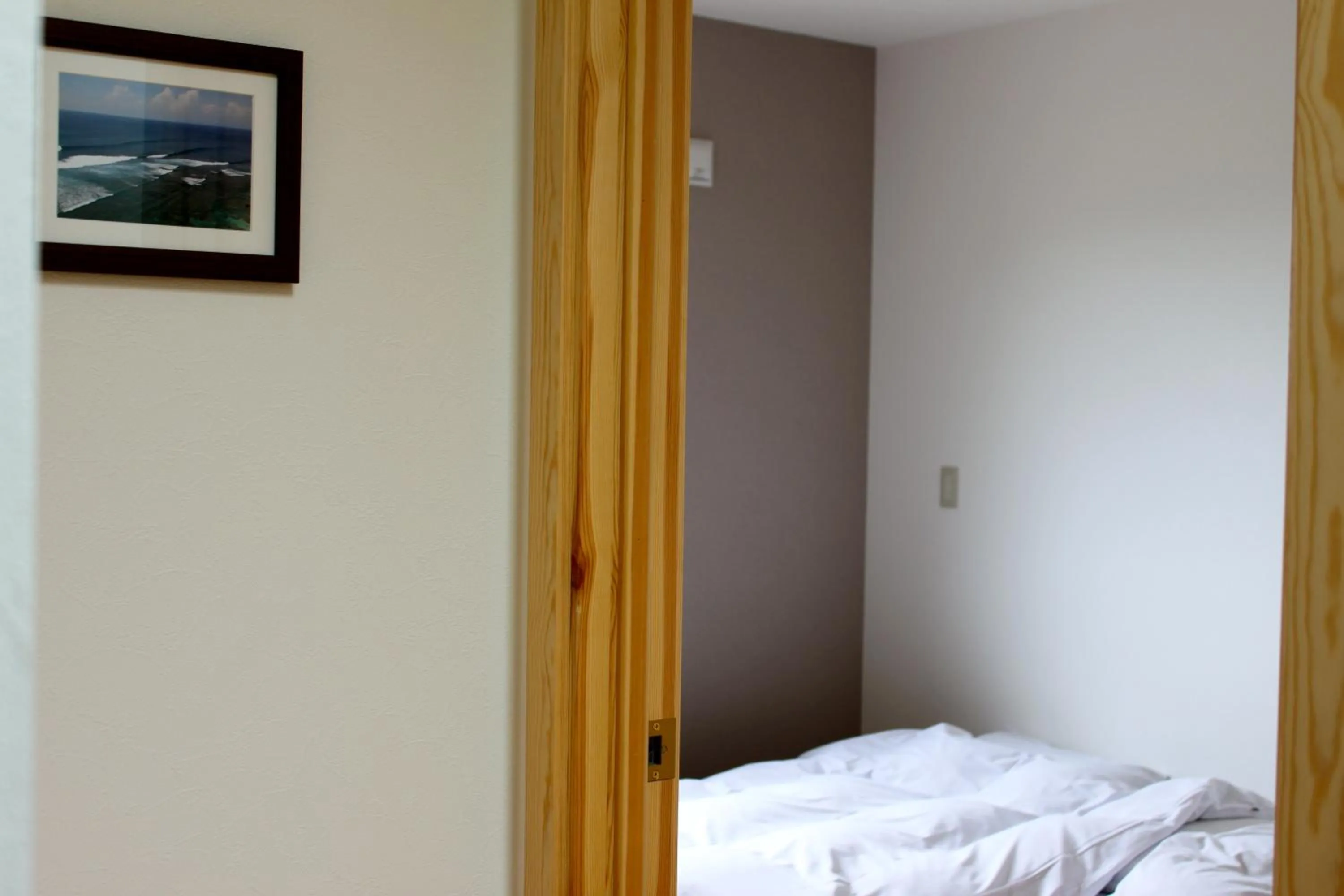 Bed in Niseko Guesthouse Nalu.