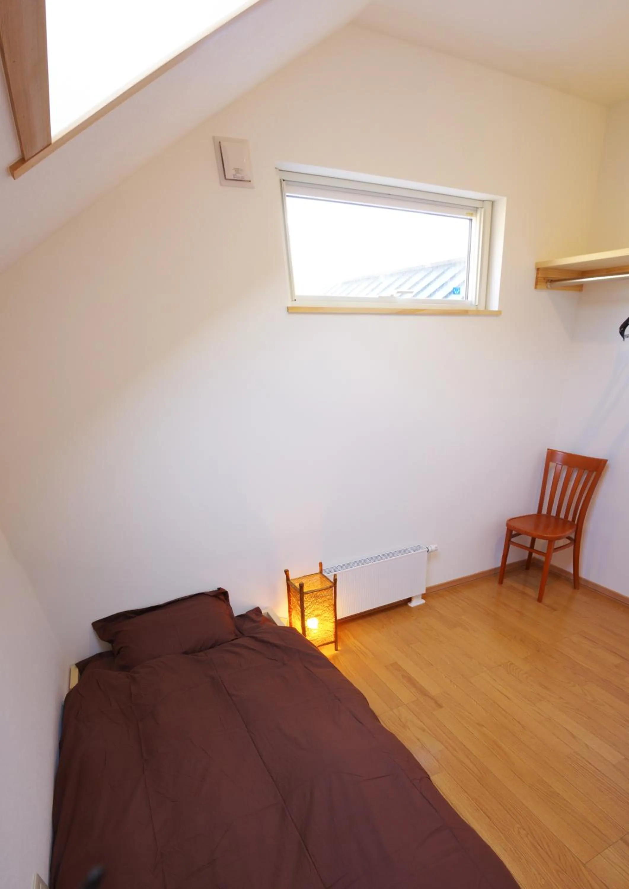 Bed in Niseko Guesthouse Nalu.