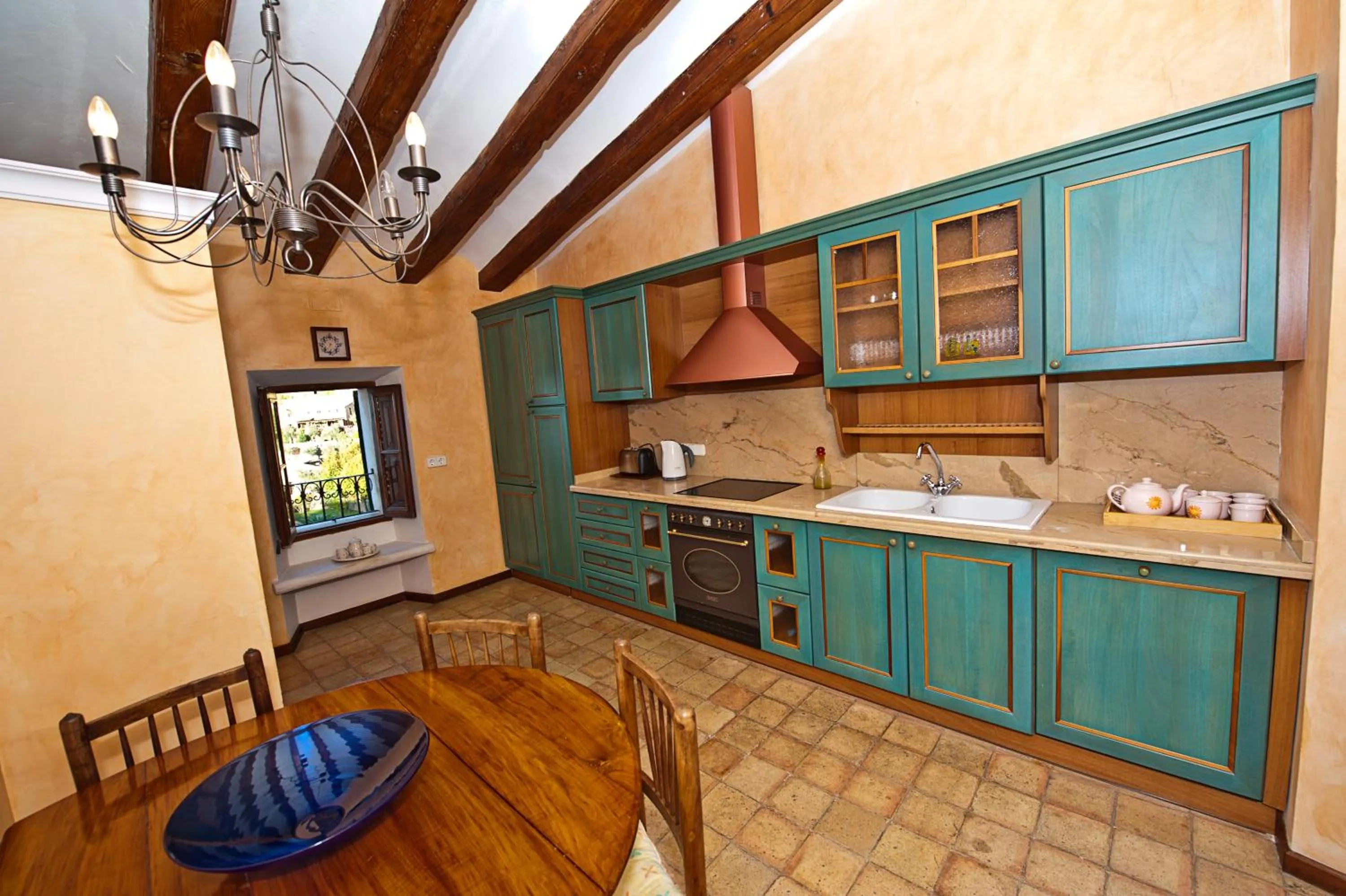 Kitchen or kitchenette in Hotel y Apartamentos DES PUIG