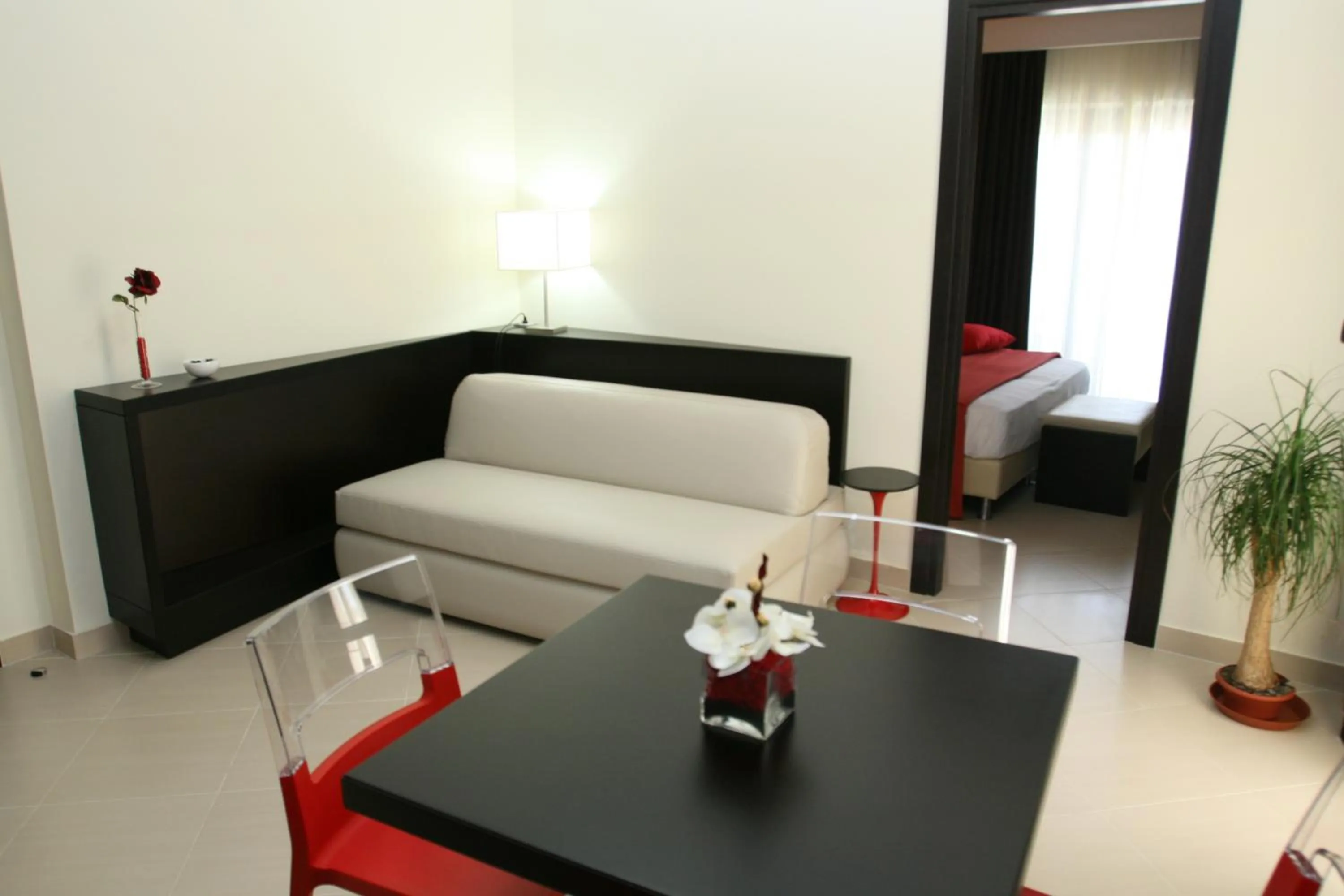 Seating area, Bed in Rama Palace Hotel