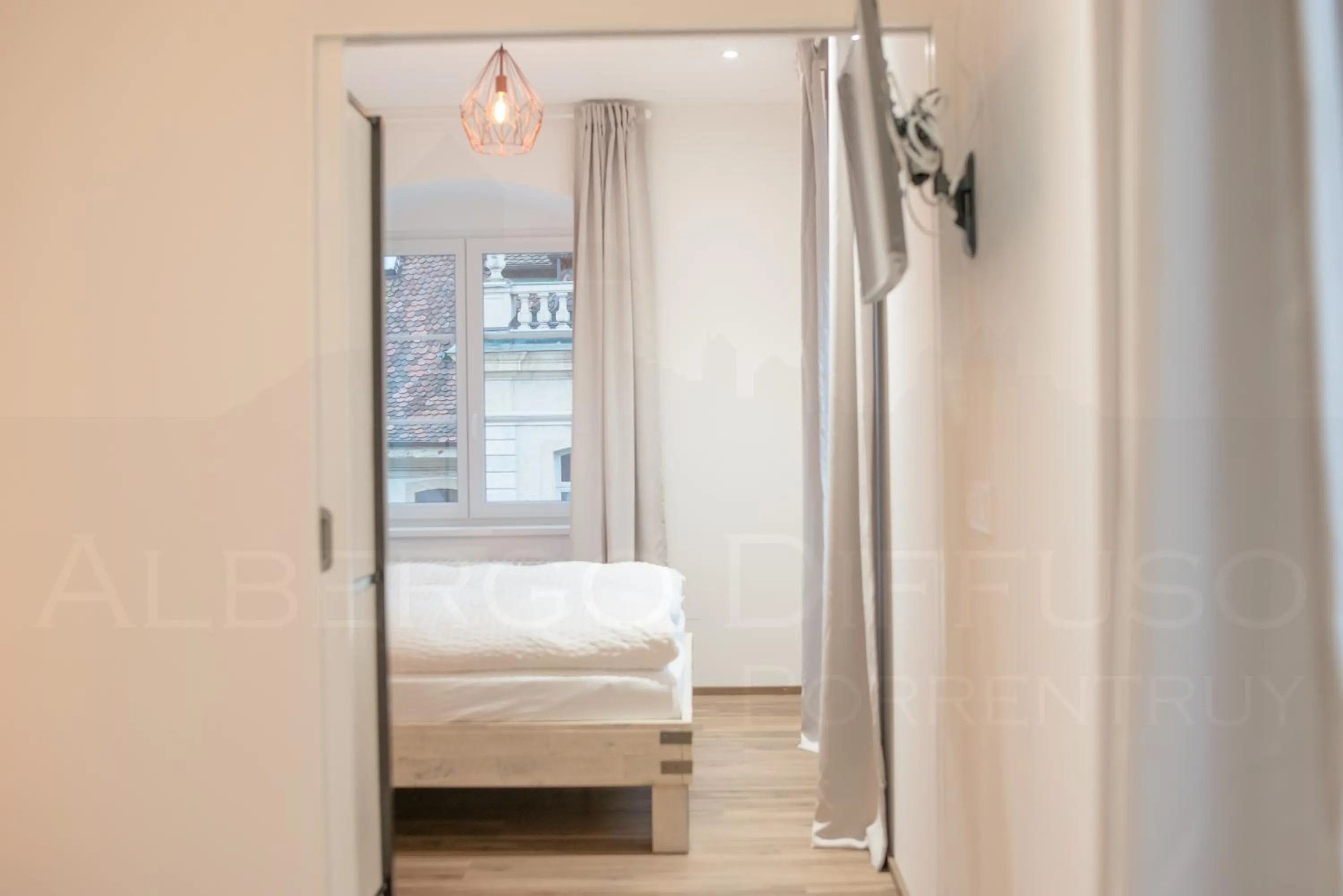 Photo of the whole room, Bed in Albergo Diffuso Porrentruy