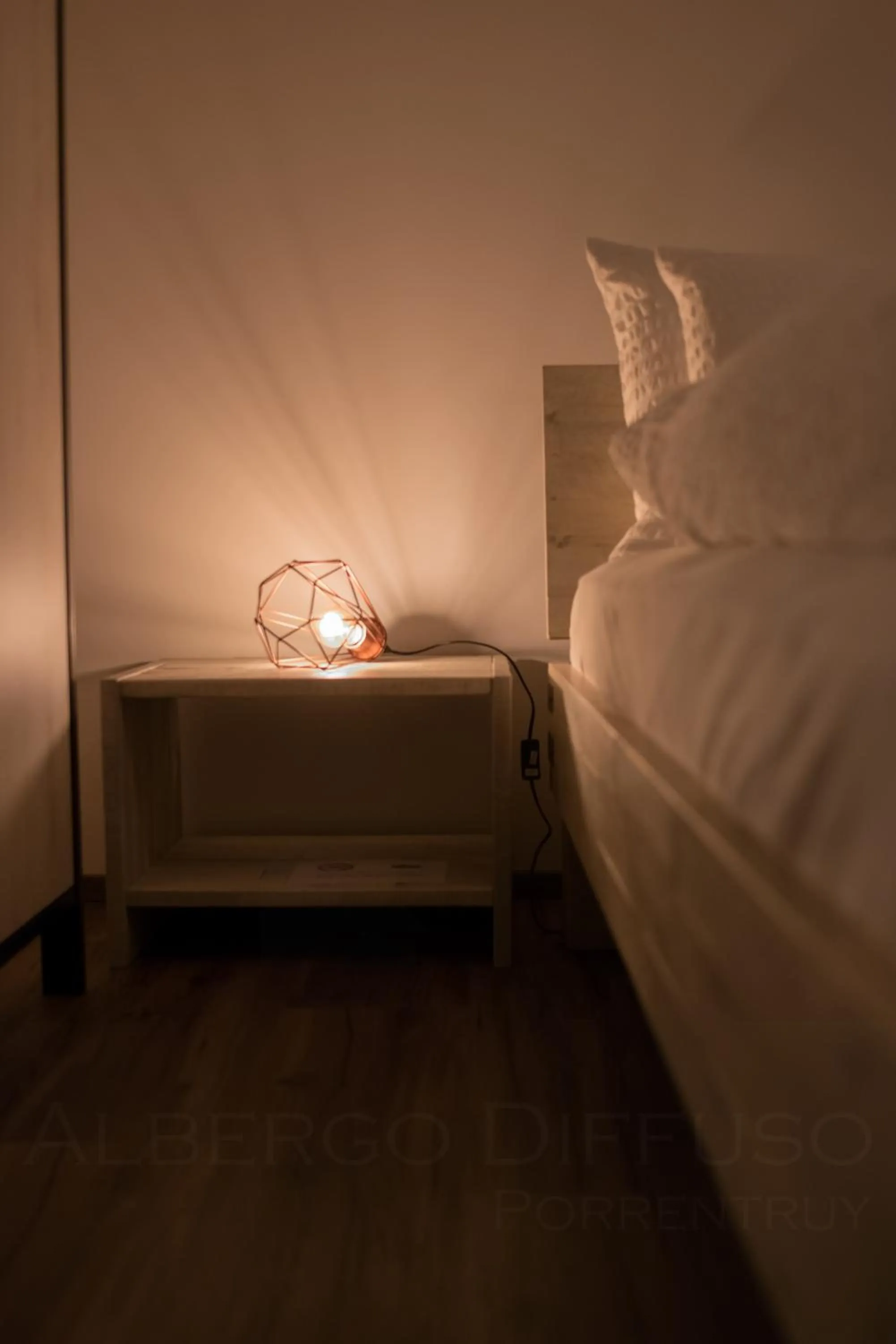 Decorative detail, Bed in Albergo Diffuso Porrentruy