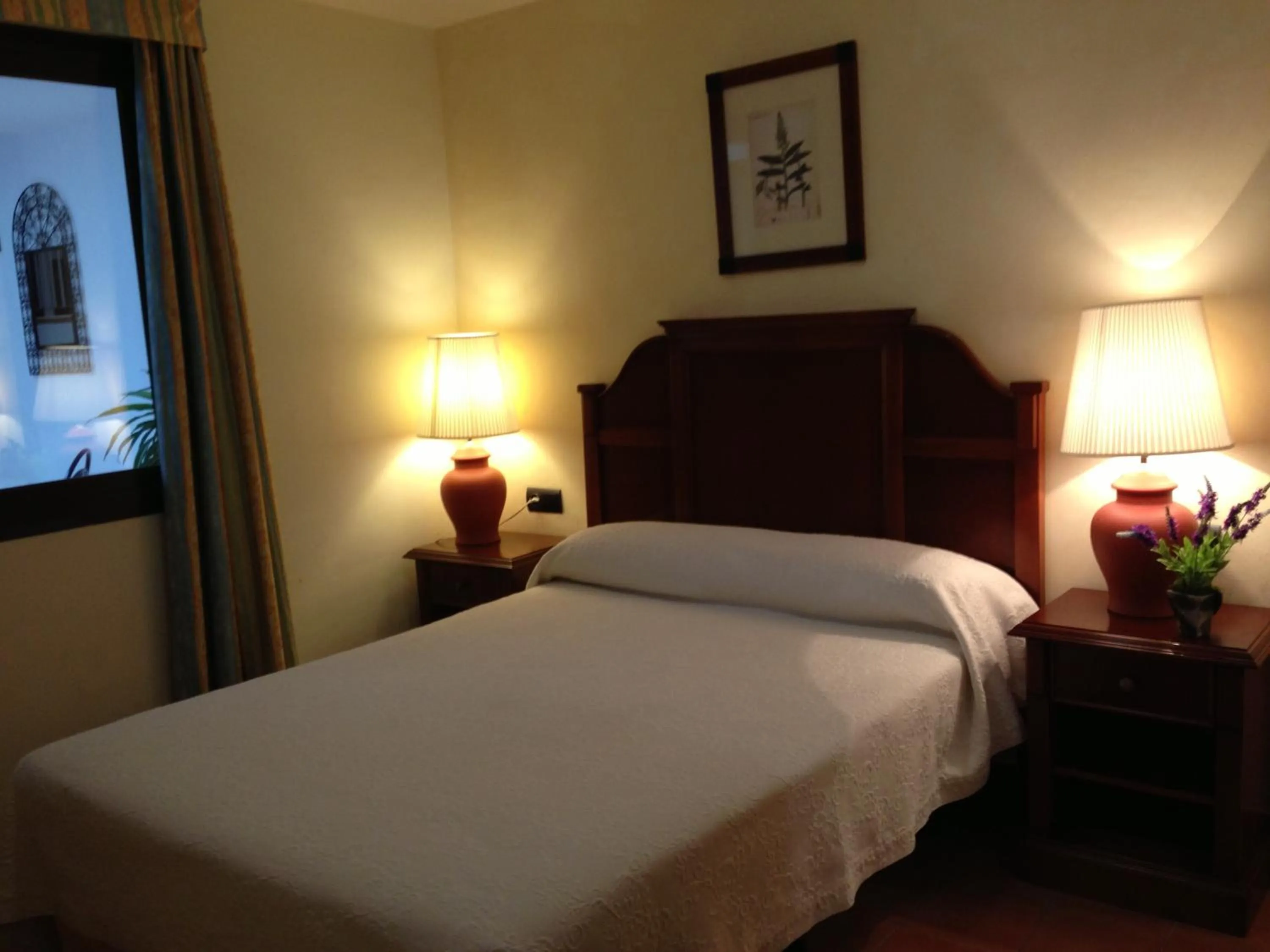 Bed in I AM La Posada Hotel and Apartment