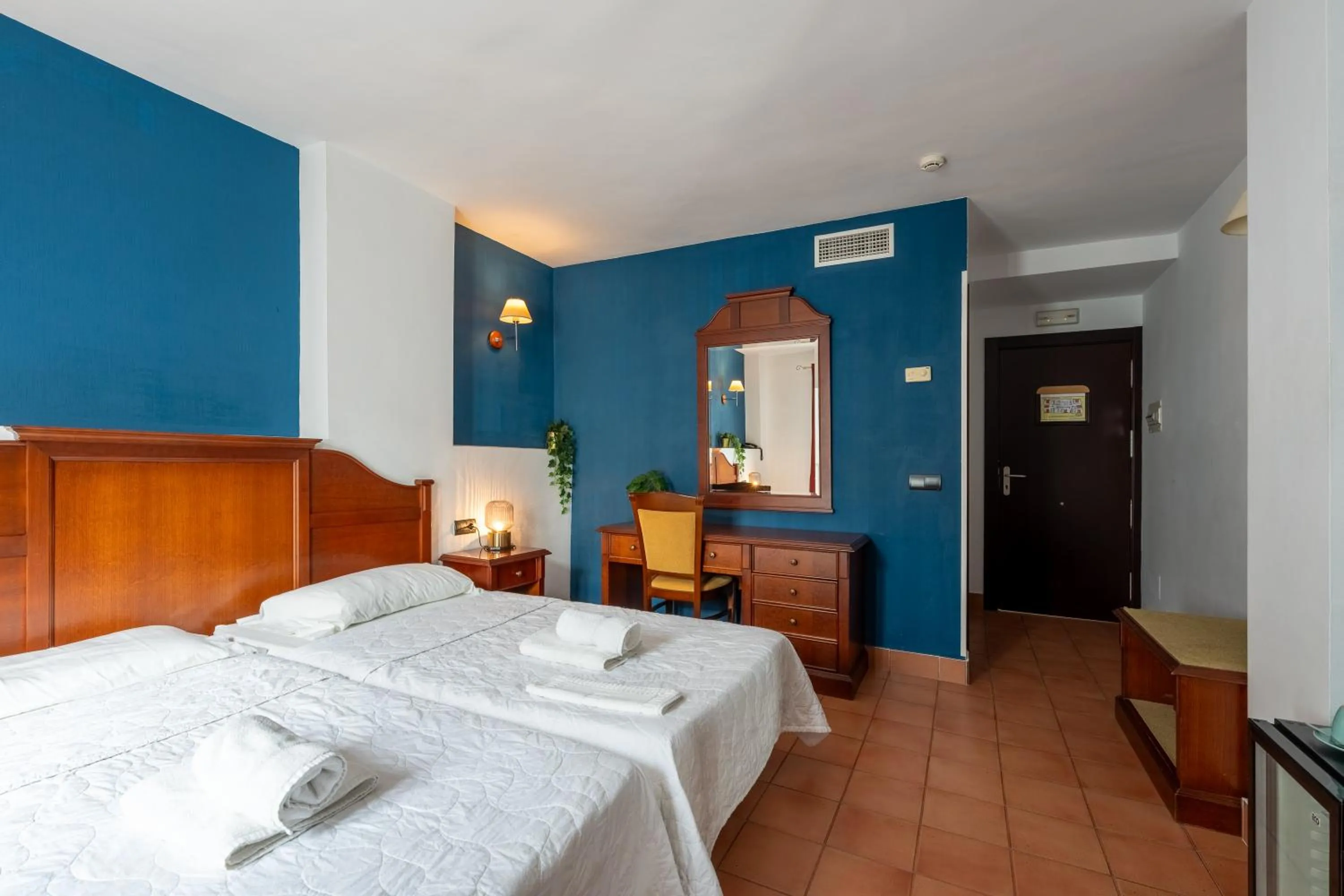 Bed in I AM La Posada Hotel and Apartment