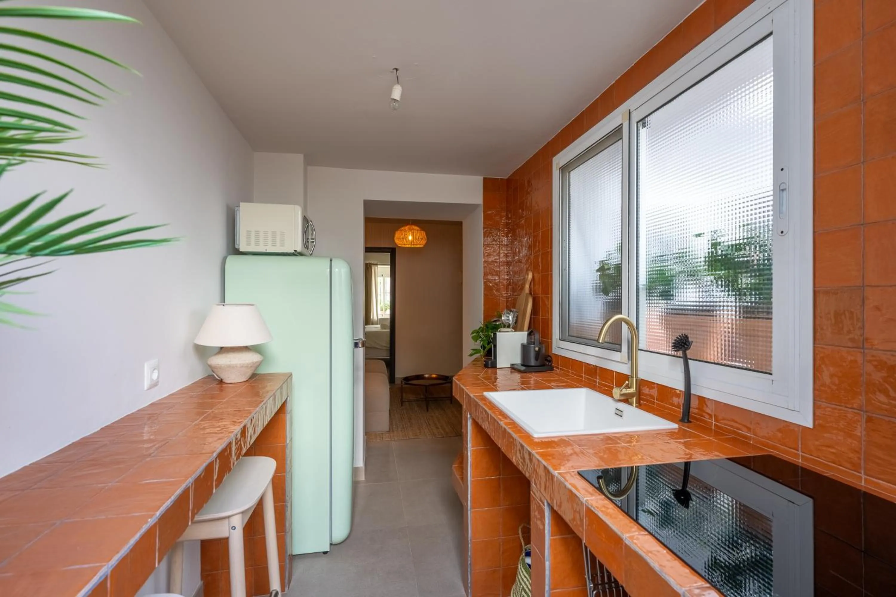 Kitchen or kitchenette in I AM La Posada Hotel and Apartment