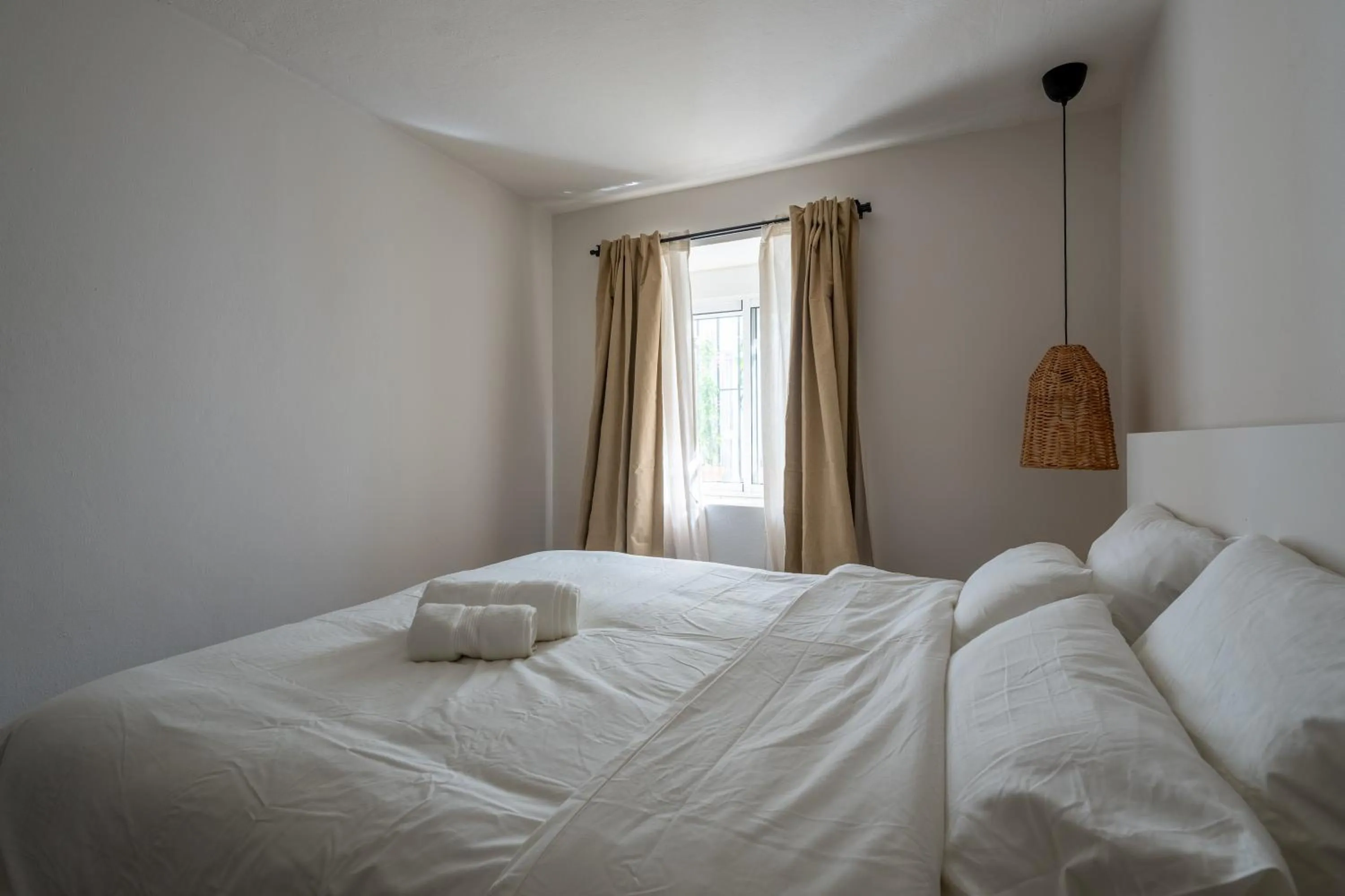 Bed in I AM La Posada Hotel and Apartment