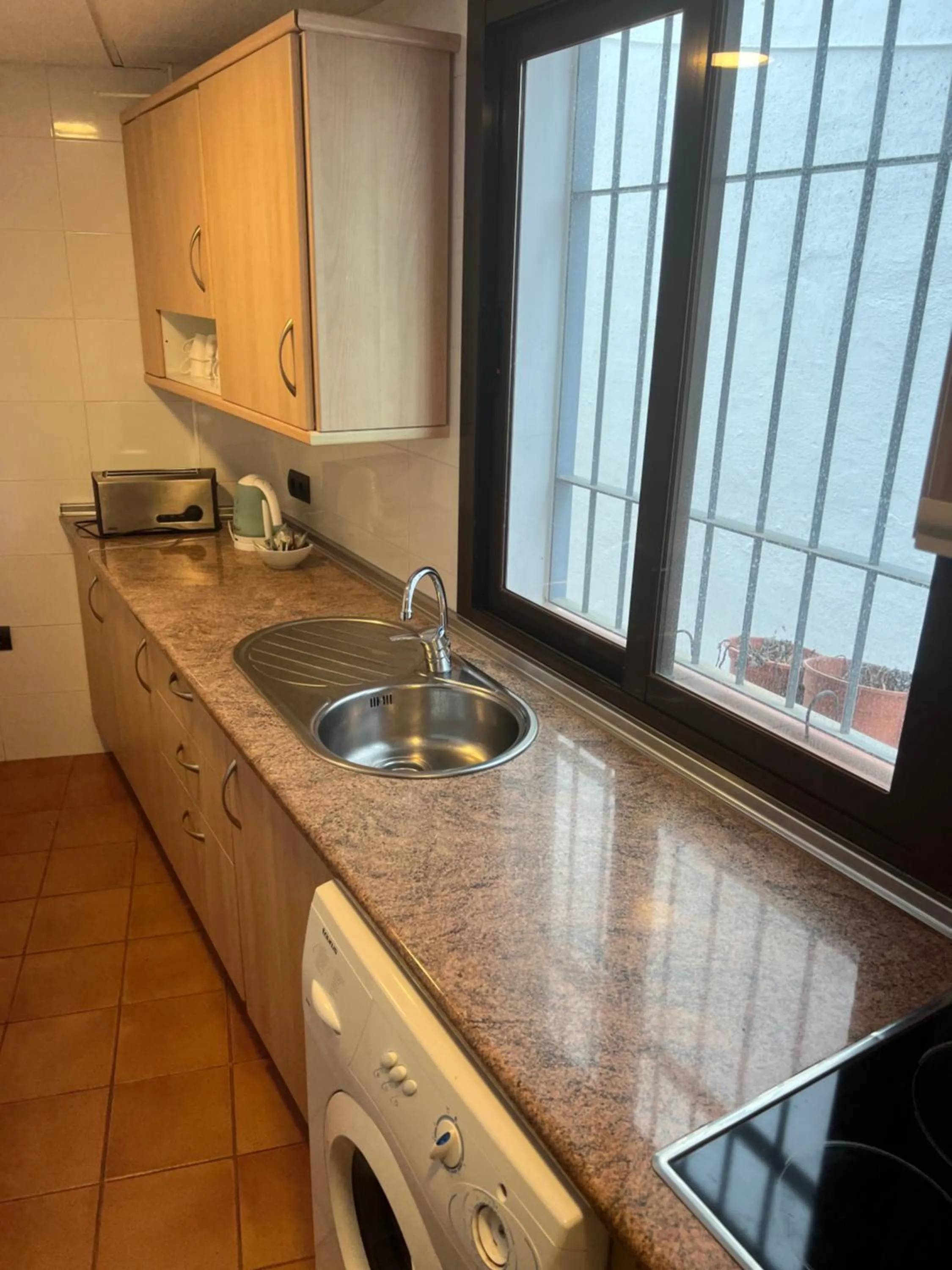 Kitchen or kitchenette in I AM La Posada Hotel and Apartment