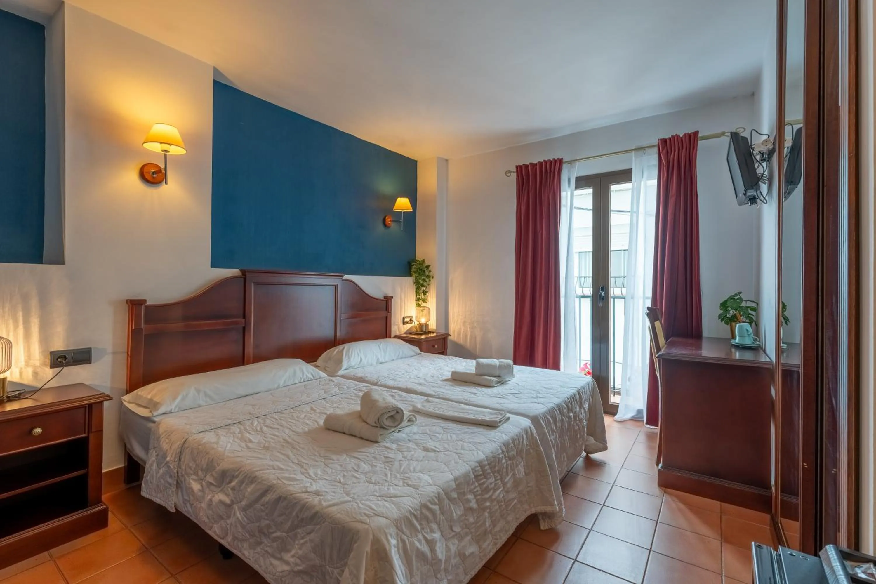 Bed in I AM La Posada Hotel and Apartment