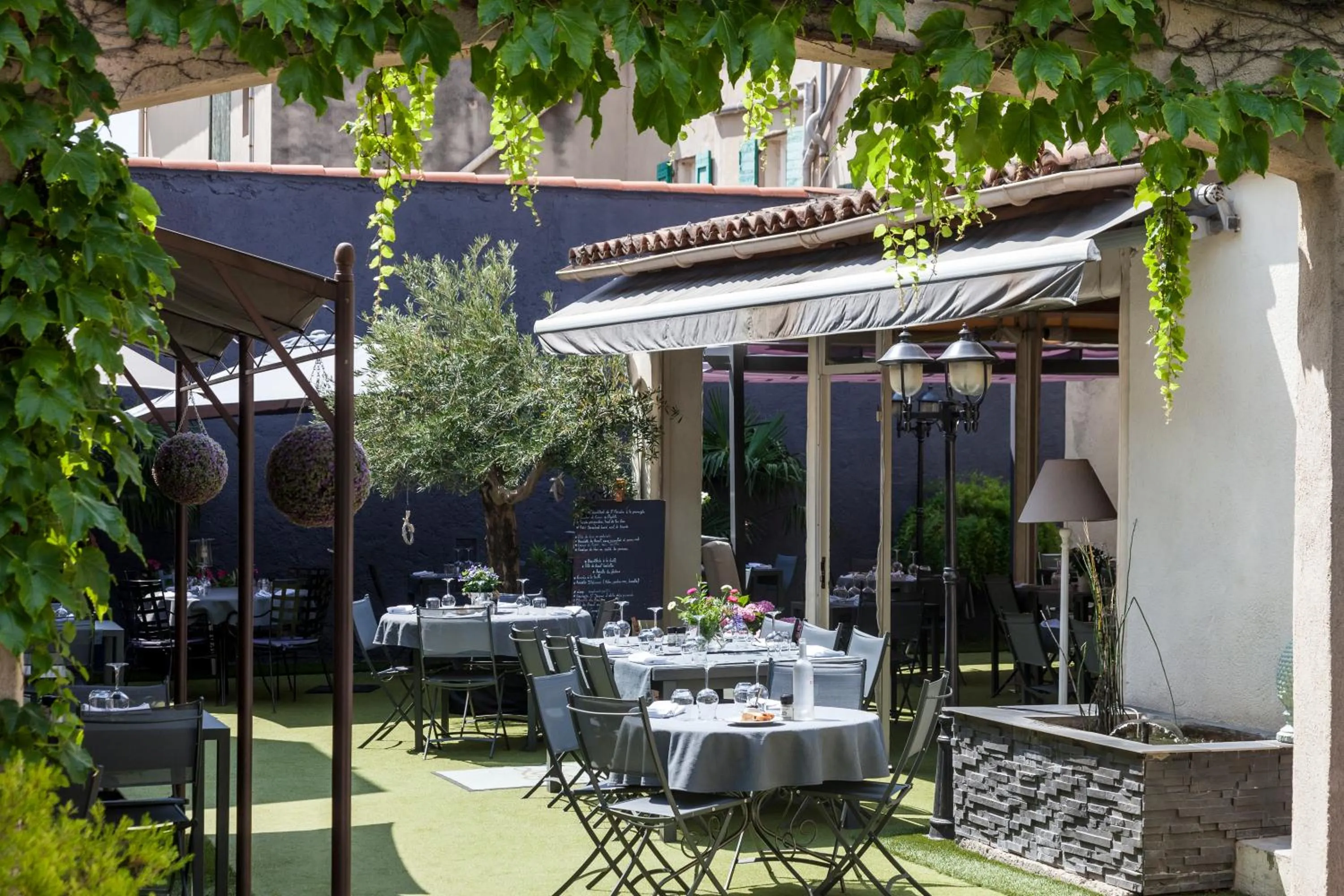 Patio in Logis Hôtel La Fenière