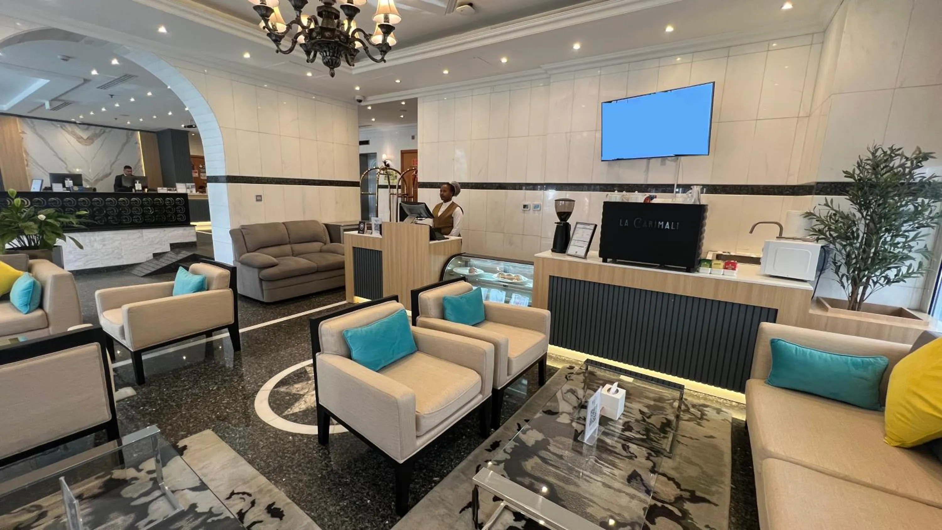 Lobby or reception in Uptown Hotel Apartments Abu Dhabi by Gewan