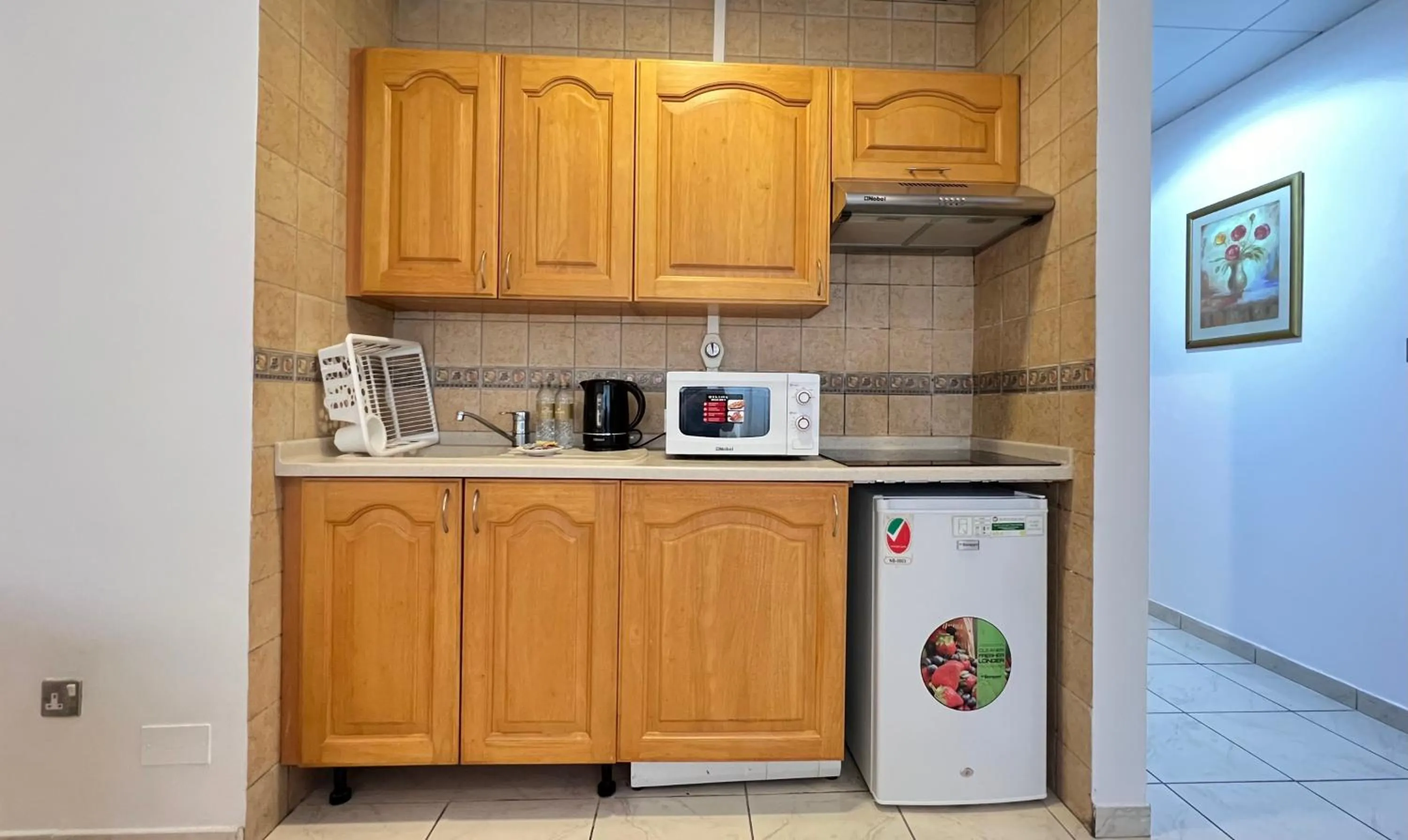 kitchen in Uptown Hotel Apartments Abu Dhabi by Gewan