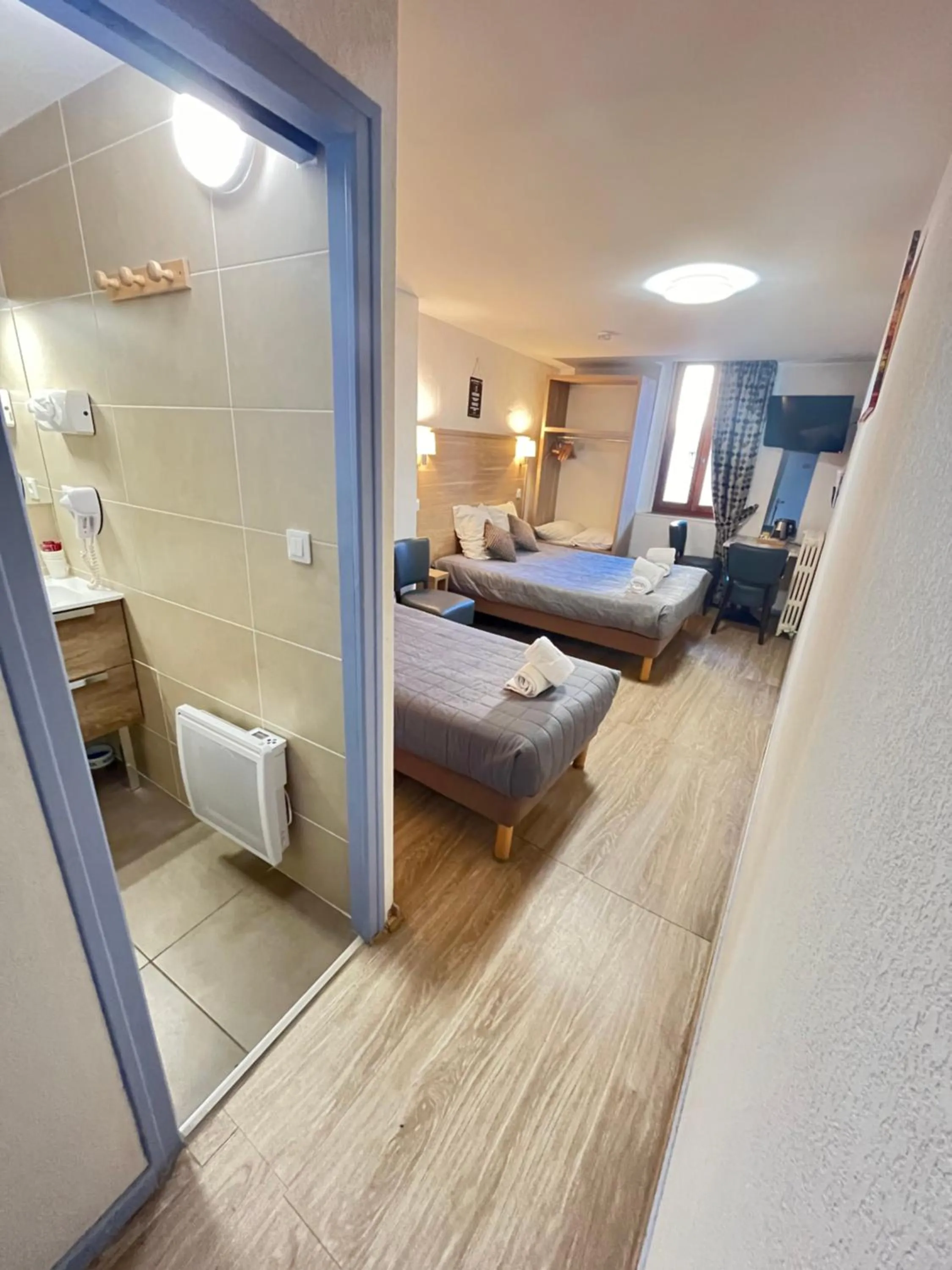 Bed in Hôtel Du Cheval Blanc Barcelonnette