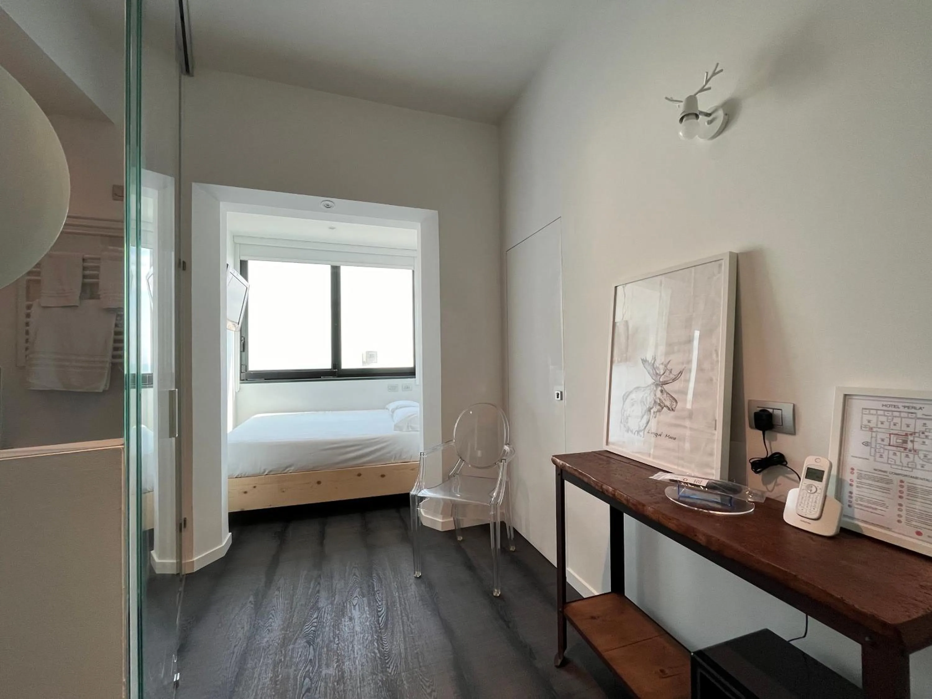 Bed in Hotel Perla - The storyhoteller