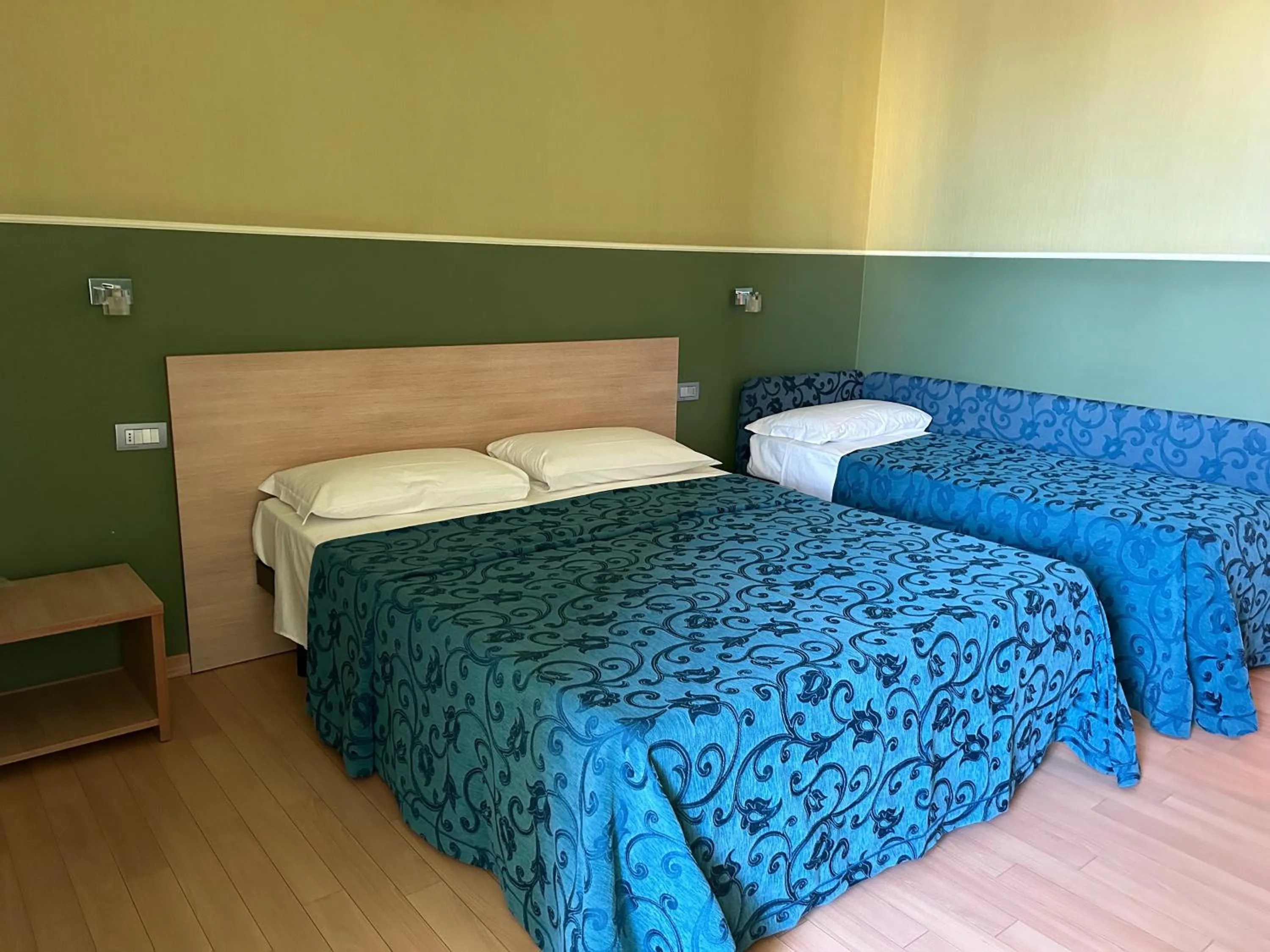 Bed in Hotel Perla - The storyhoteller