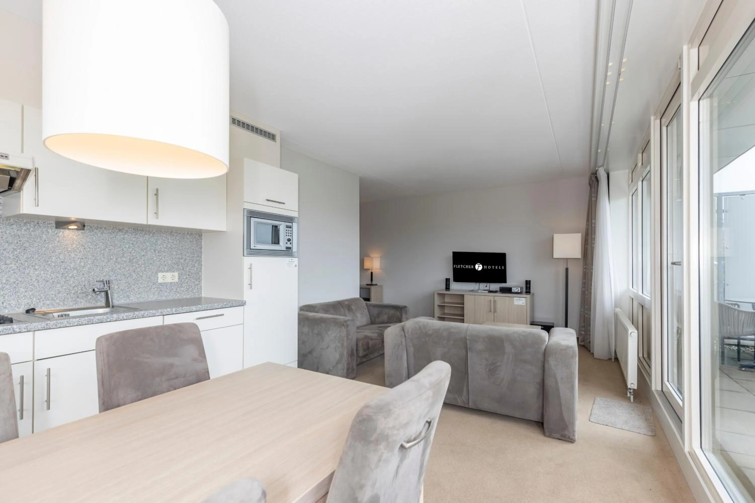 Kitchen or kitchenette in Fletcher Wellness-Hotel Kamperduinen