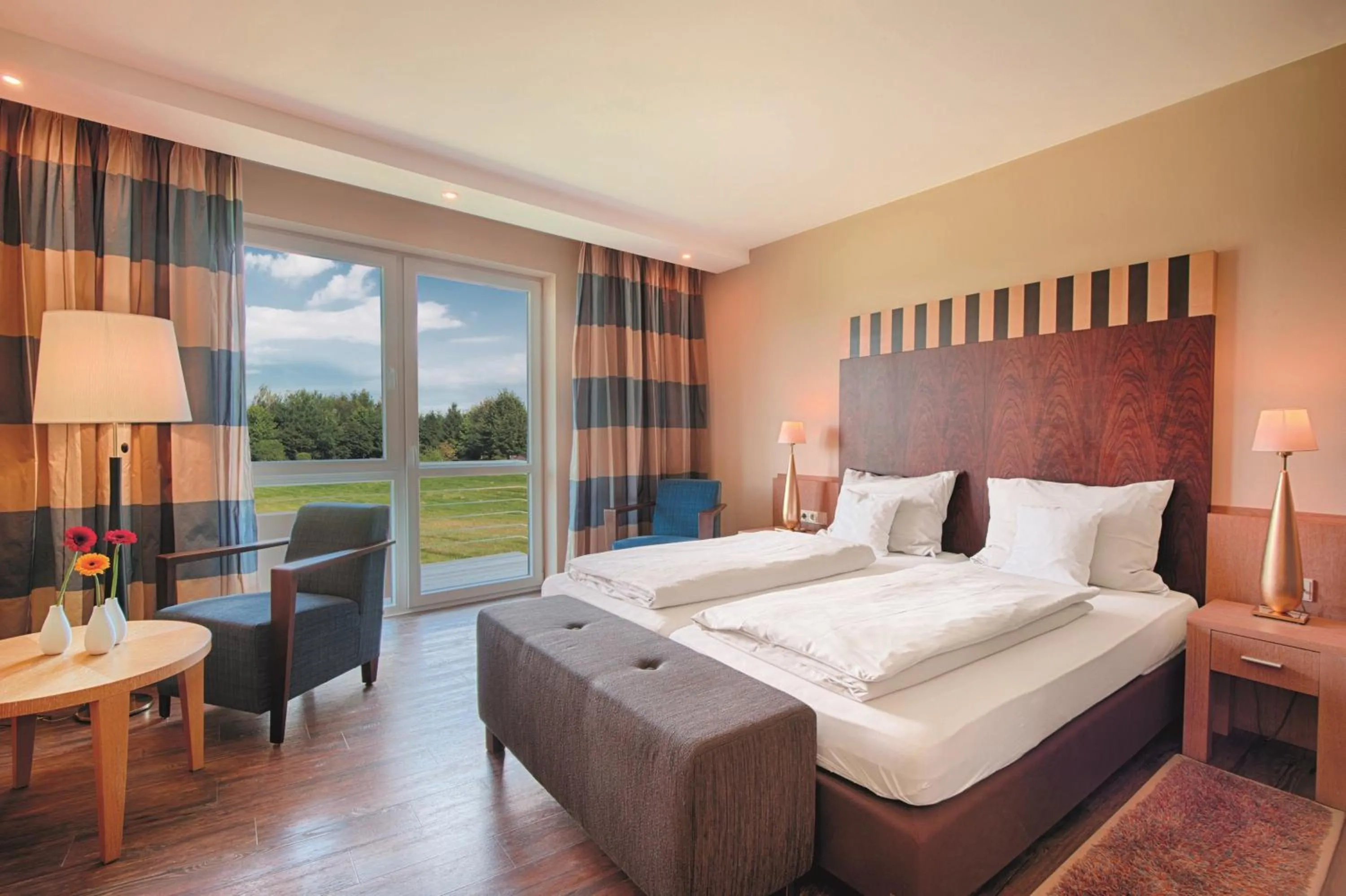 Photo of the whole room, Bed in Golf & Resort Hotel Gut Heckenhof