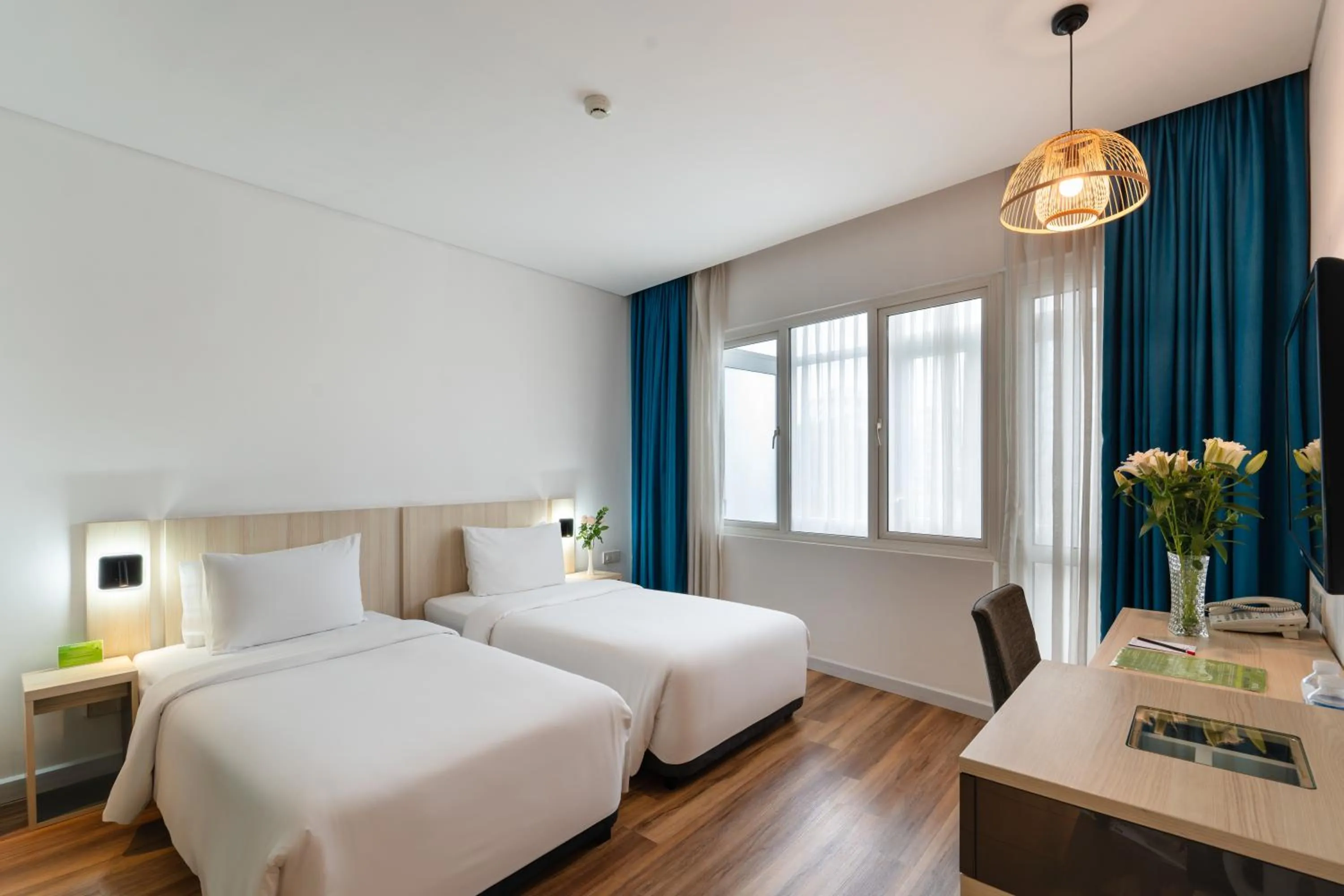 Bed in Liberty Hotel Saigon Greenview