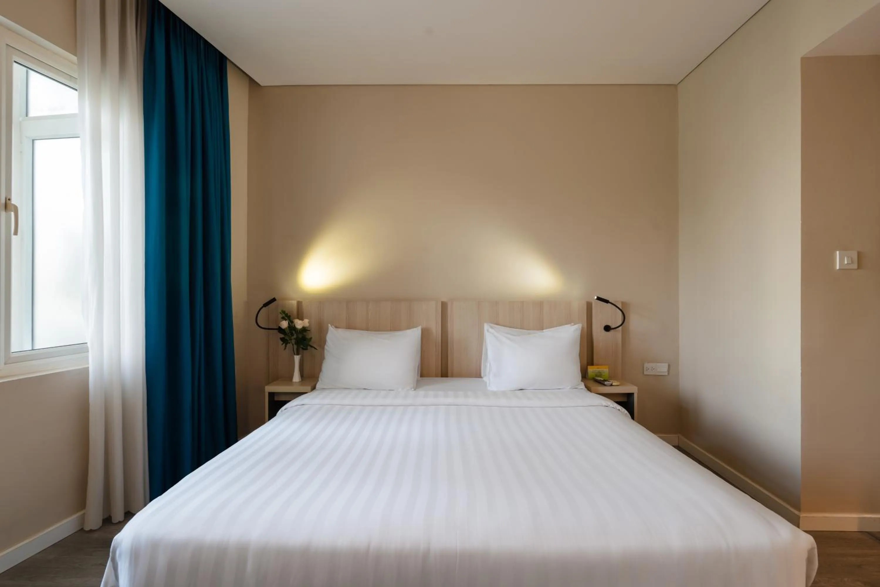 Bed in Liberty Hotel Saigon Greenview