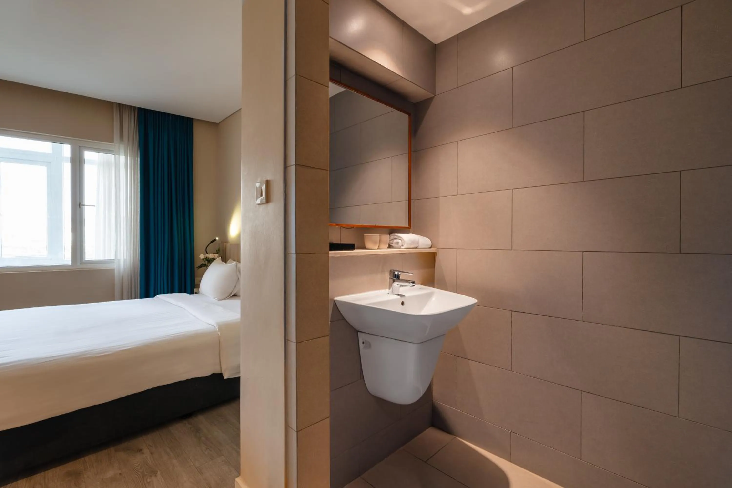 Bed in Liberty Hotel Saigon Greenview