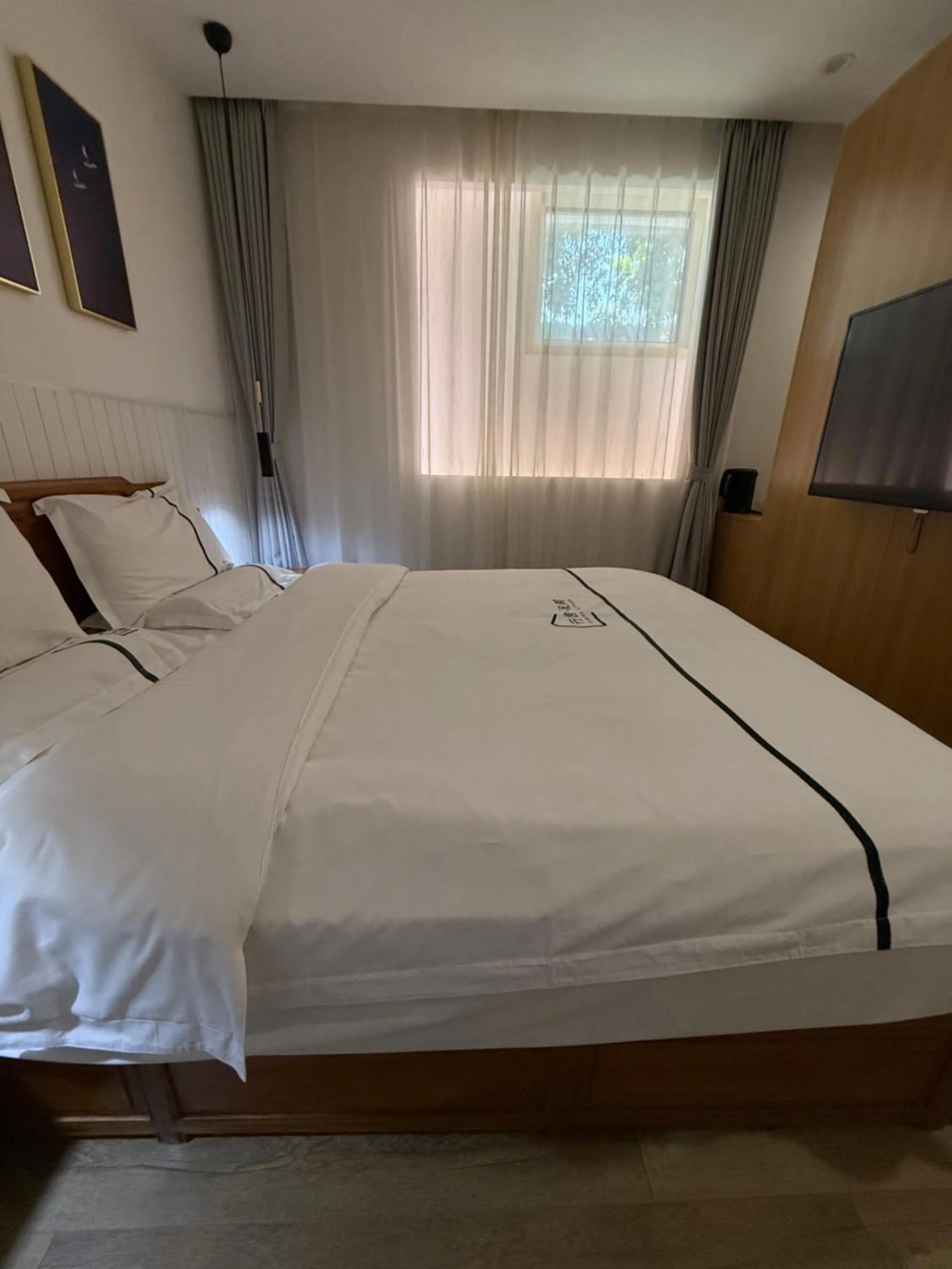 Bed in Xingshe Alley Courtyard Hotel Beijing Wangfujing Forbidden City