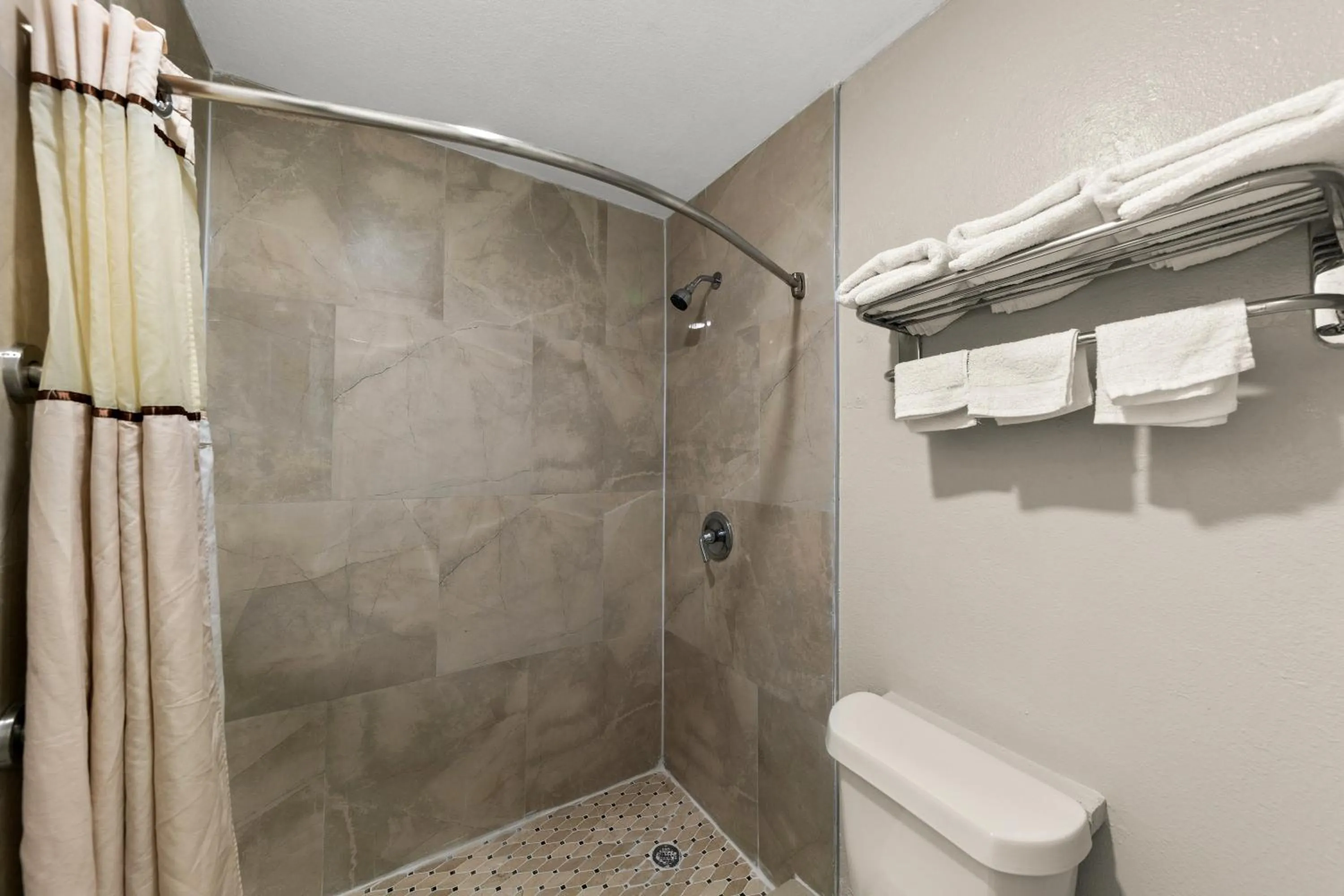 Shower in Americas Best Value Inn Bonham