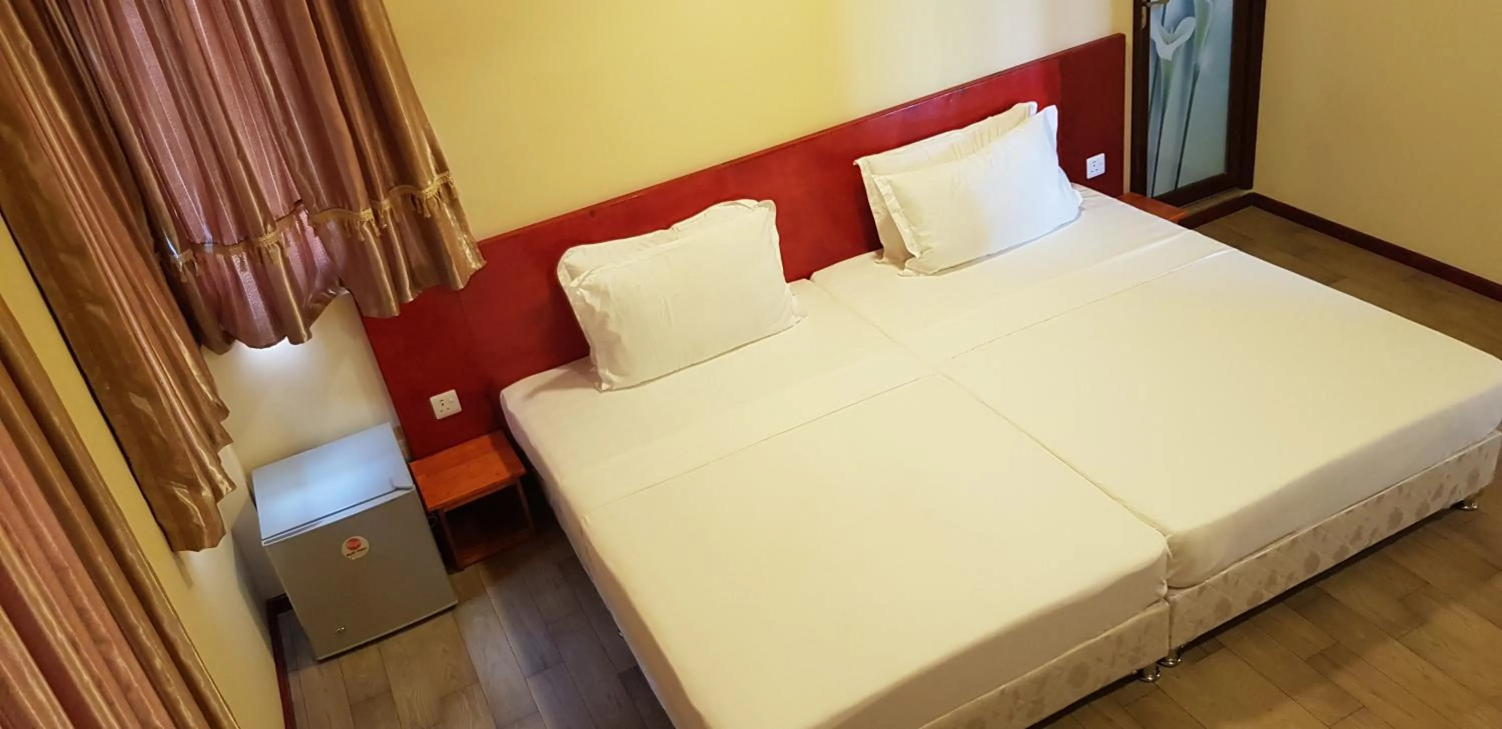 Bed in Annama Lodge and Dive